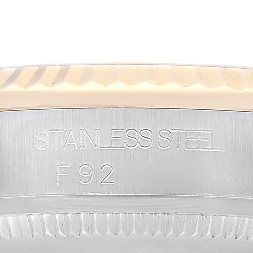 This Rolex Mid-Size 178273 Women's Steel and Gold (two tone) Champagne Dial 178273 Women's Steel and Gold (two tone) Champagne Dial watch image shows a side view of the stainless steel casing with engravings.