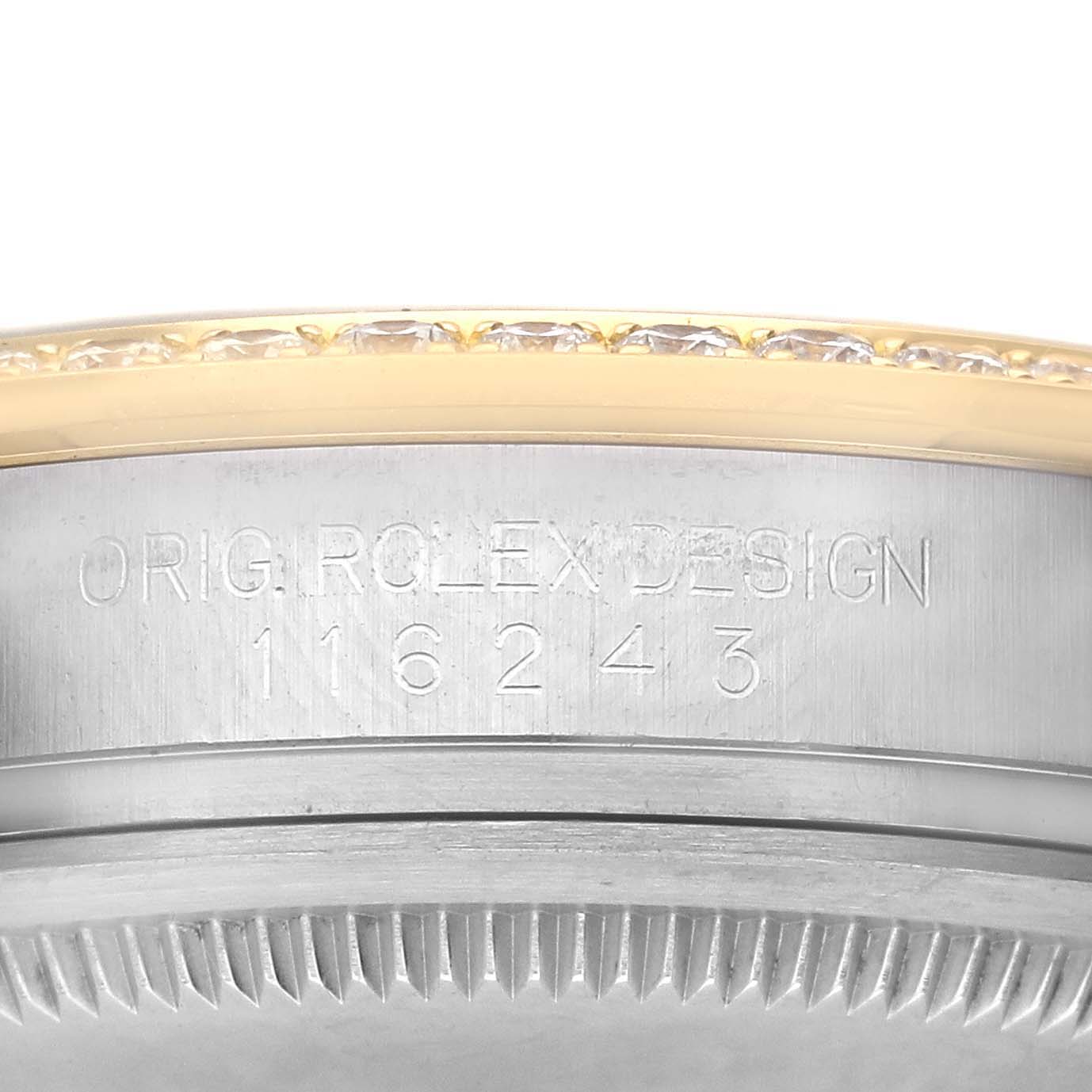 The image shows a close-up of the edge and side case of a Rolex Datejust 116243 Men
s Steel and Gold (two tone) Silver Dial 116243 Men
s Steel and Gold (two tone) Silver Dial, highlighting the model number engraving.