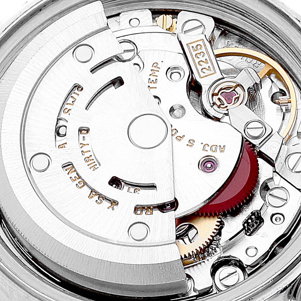 This image shows a close-up of the internal mechanism of a Rolex Datejust 79174 Women's Stainless Steel Blue Dial 79174 Women's Stainless Steel Blue Dial watch, highlighting its intricate movement parts.