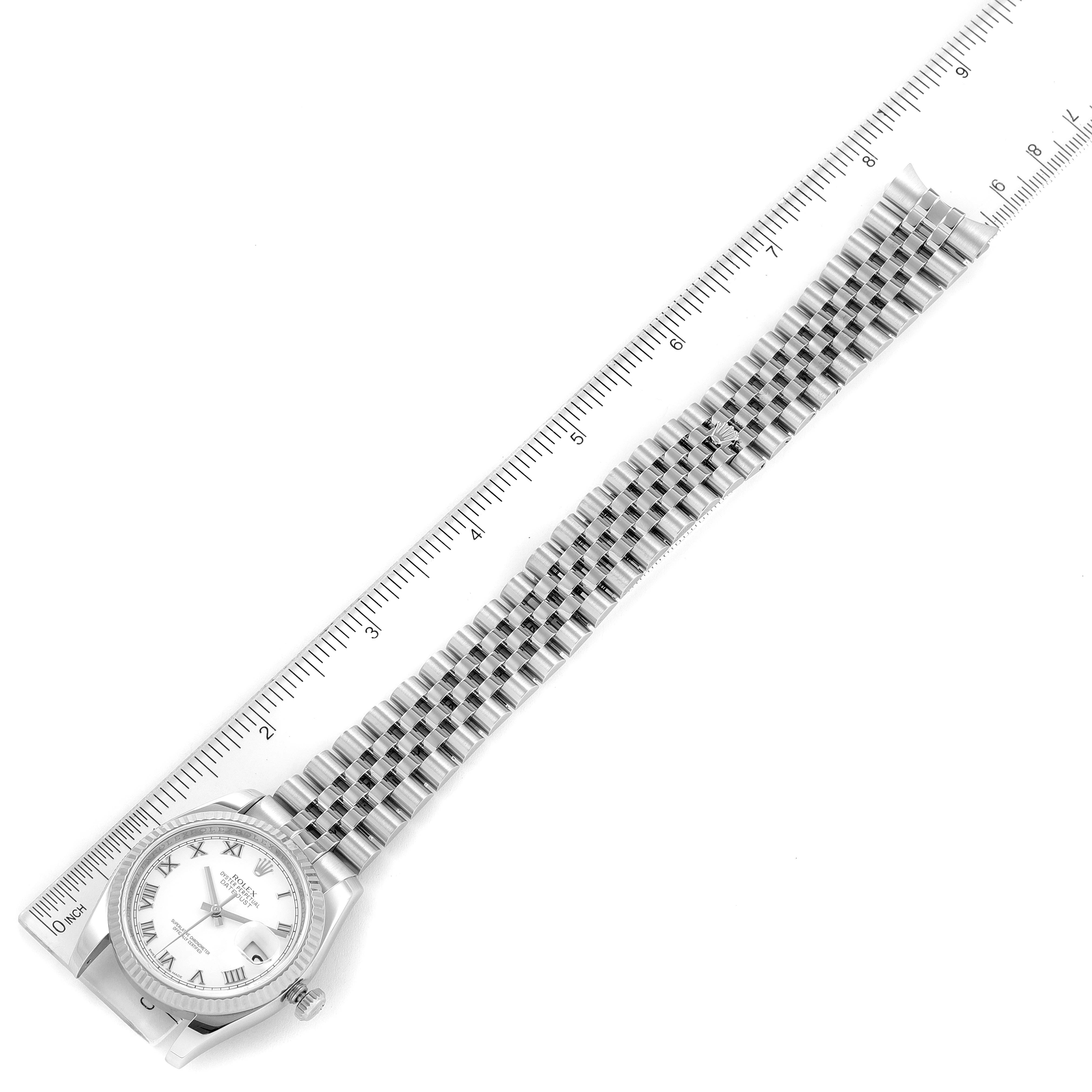 The image shows the Rolex Datejust 116234 Men's Stainless Steel White Dial 116234 Men's Stainless Steel White Dial watch laid flat, with the case, dial, and full bracelet visible, alongside a ruler for scale.