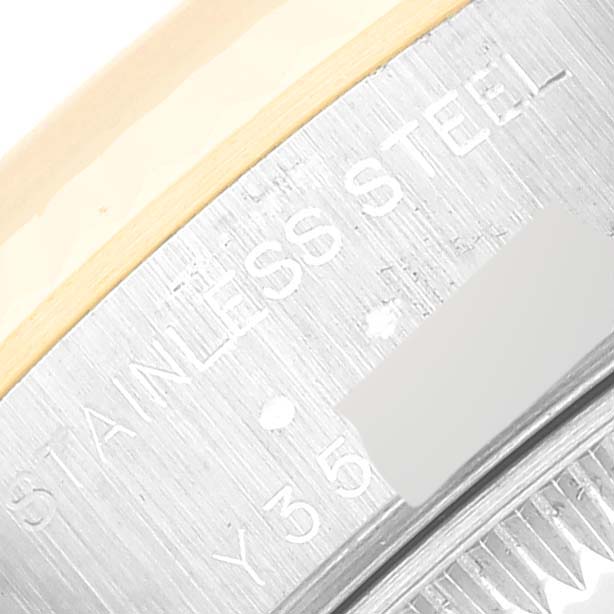 This close-up image shows the case side of a Rolex Datejust 79173 Women's Steel and Gold (two tone) Blue Dial 79173 Women's Steel and Gold (two tone) Blue Dial watch, highlighting the stainless steel engraving.
