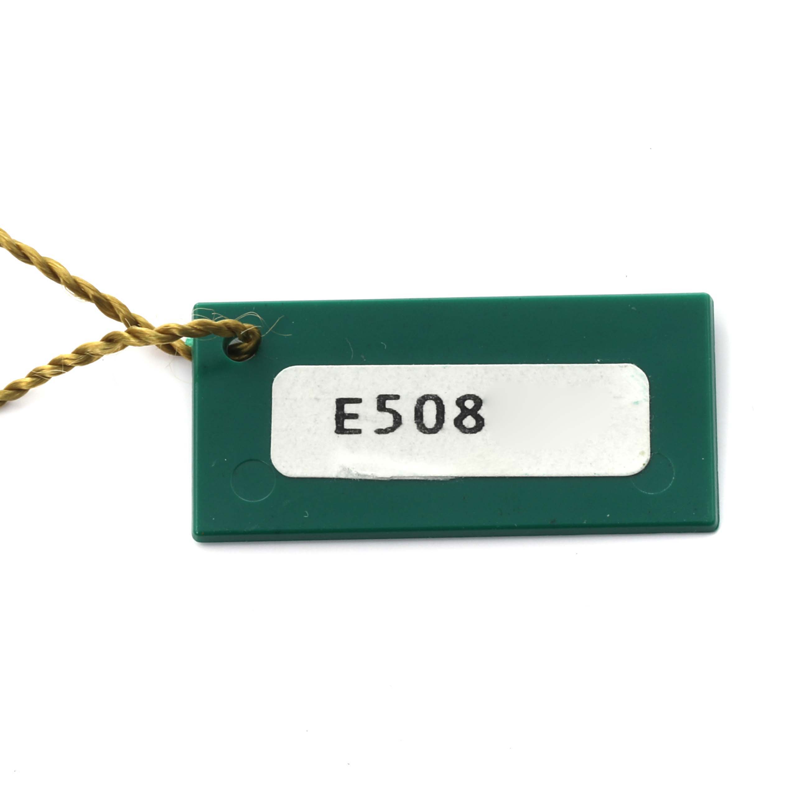The image shows a green tag accessory for a Rolex Datejust 69173 Women's Steel and Gold (two tone) Champagne Dial 69173 Women's Steel and Gold (two tone) Champagne Dial watch, featuring the code "E508."
