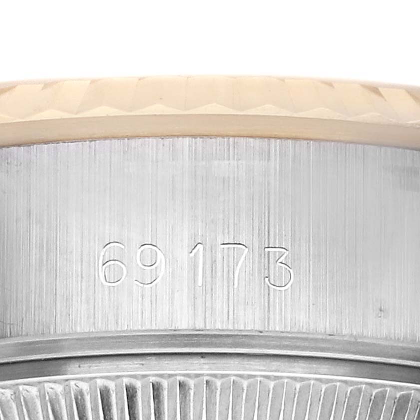 The image shows a close-up of the Rolex Datejust 69173 Women's Steel and Gold (two tone) Champagne Dial 69173 Women's Steel and Gold (two tone) Champagne Dial's bezel and case, highlighting the model number engraving.