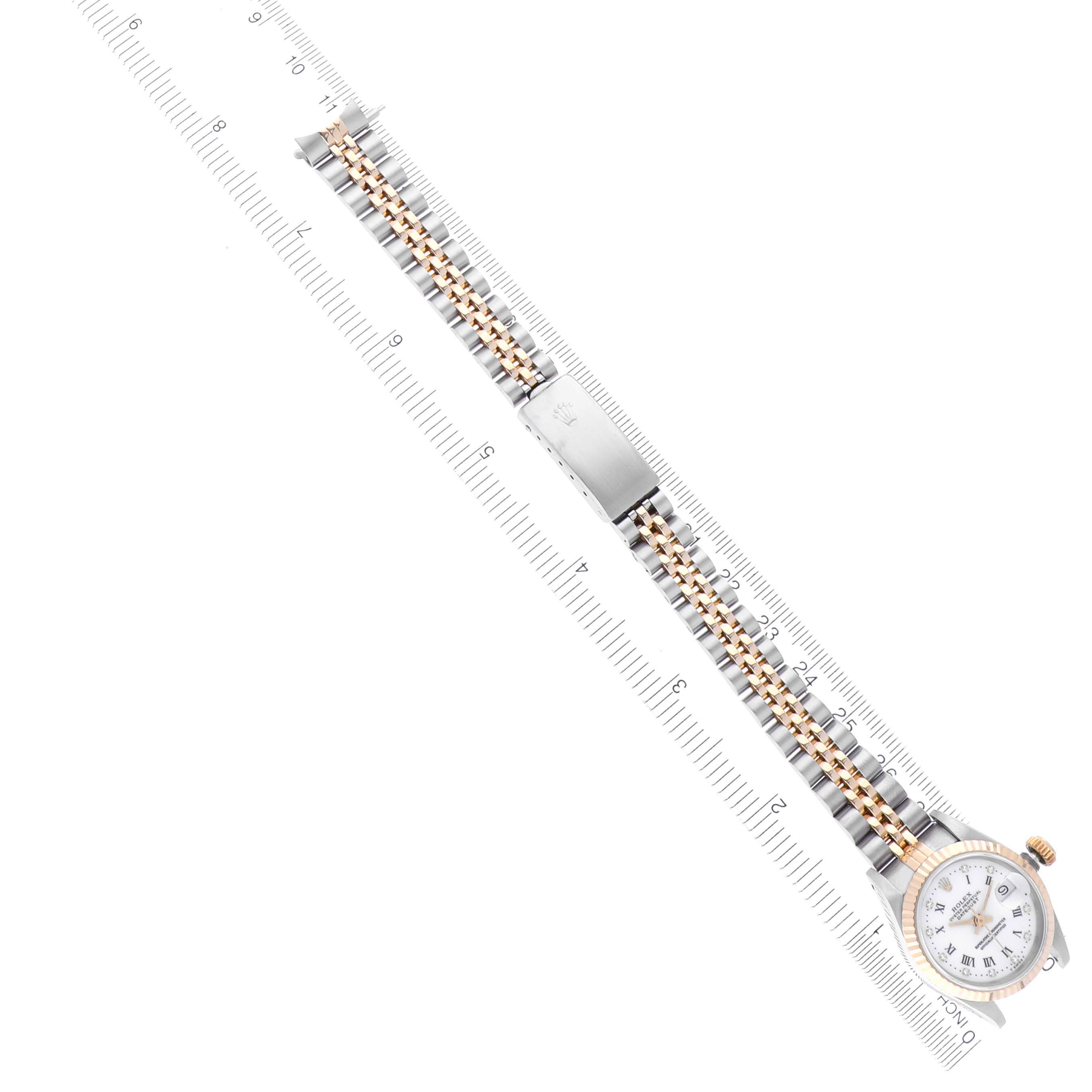 The Rolex Datejust 69173 Women's Steel and Gold (two tone) White Dial 69173 Women's Steel and Gold (two tone) White Dial watch is shown at an oblique angle, featuring its full bracelet, clasp, and watch face.