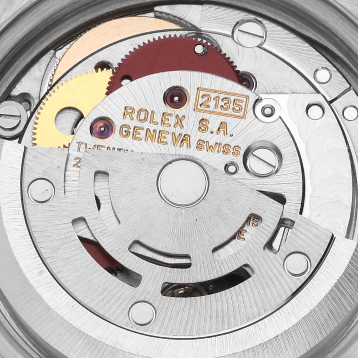 This image shows the movement mechanism of a Rolex Datejust 69173 Women's Steel and Gold (two tone) White Dial 69173 Women's Steel and Gold (two tone) White Dial, highlighting gears and engravings at a close-up angle.