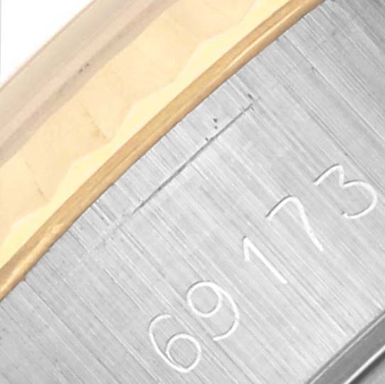 The image shows the engraved model number on the side of the Rolex Datejust 69173 Women's Steel and Gold (two tone) White Dial 69173 Women's Steel and Gold (two tone) White Dial watch case.