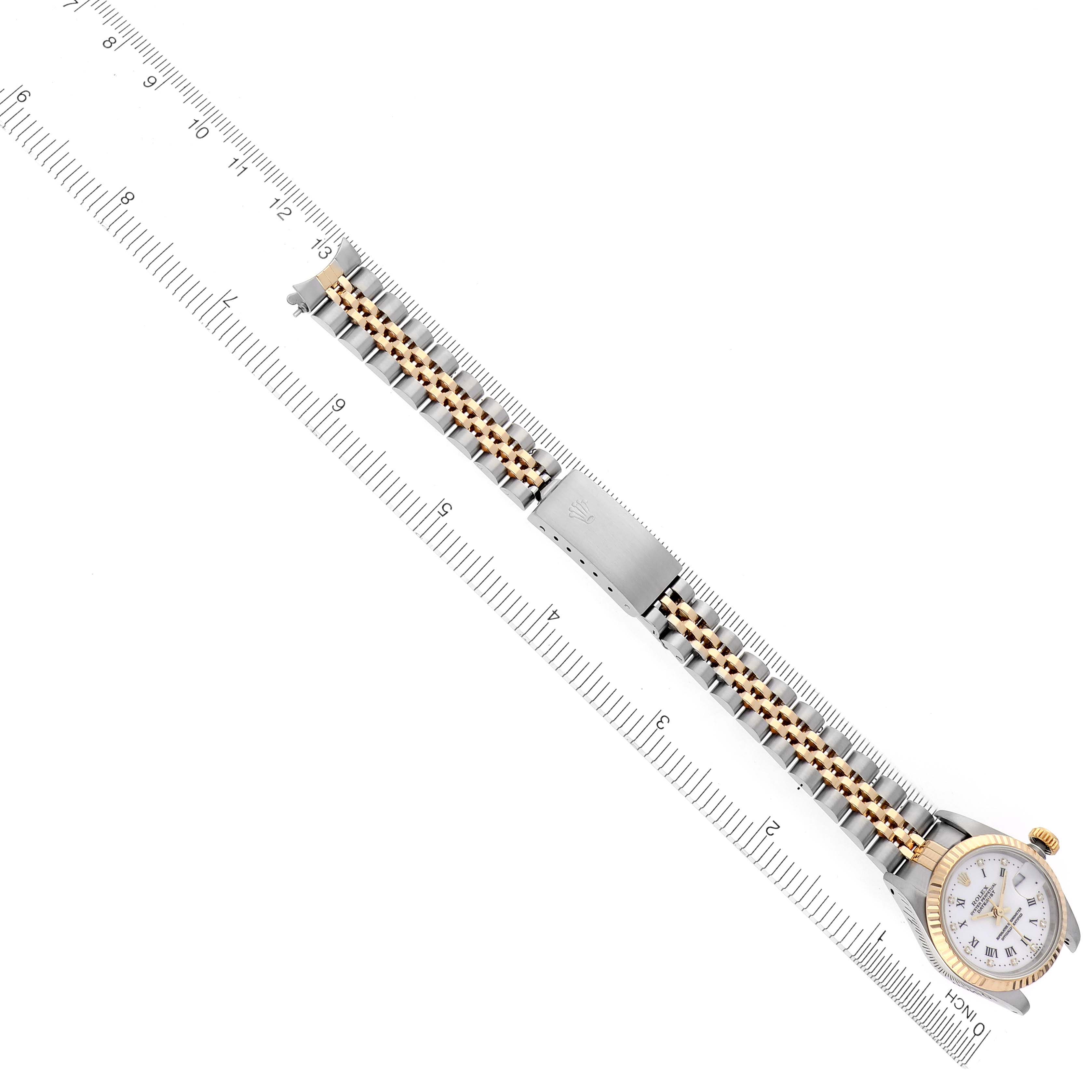 The Rolex Datejust 69173 Women's Steel and Gold (two tone) White Dial 69173 Women's Steel and Gold (two tone) White Dial watch is shown from a top-down angle, displaying the bracelet, clasp, bezel, and dial.
