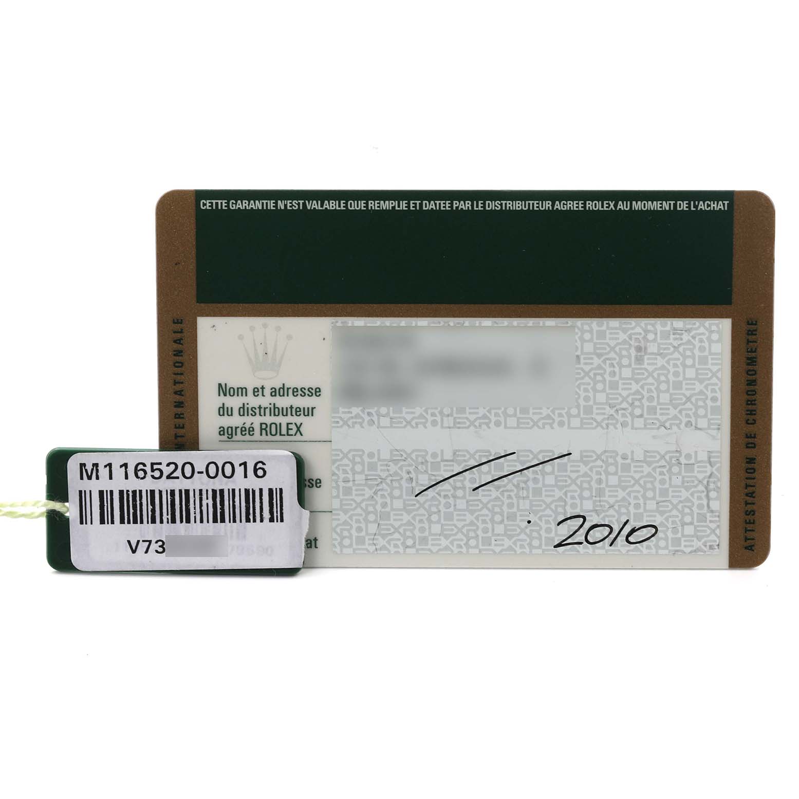 The image shows a warranty card and tag for a Rolex Daytona 116520 Men's Stainless Steel White Dial 116520 Men's Stainless Steel White Dial model, displaying details such as the model number.