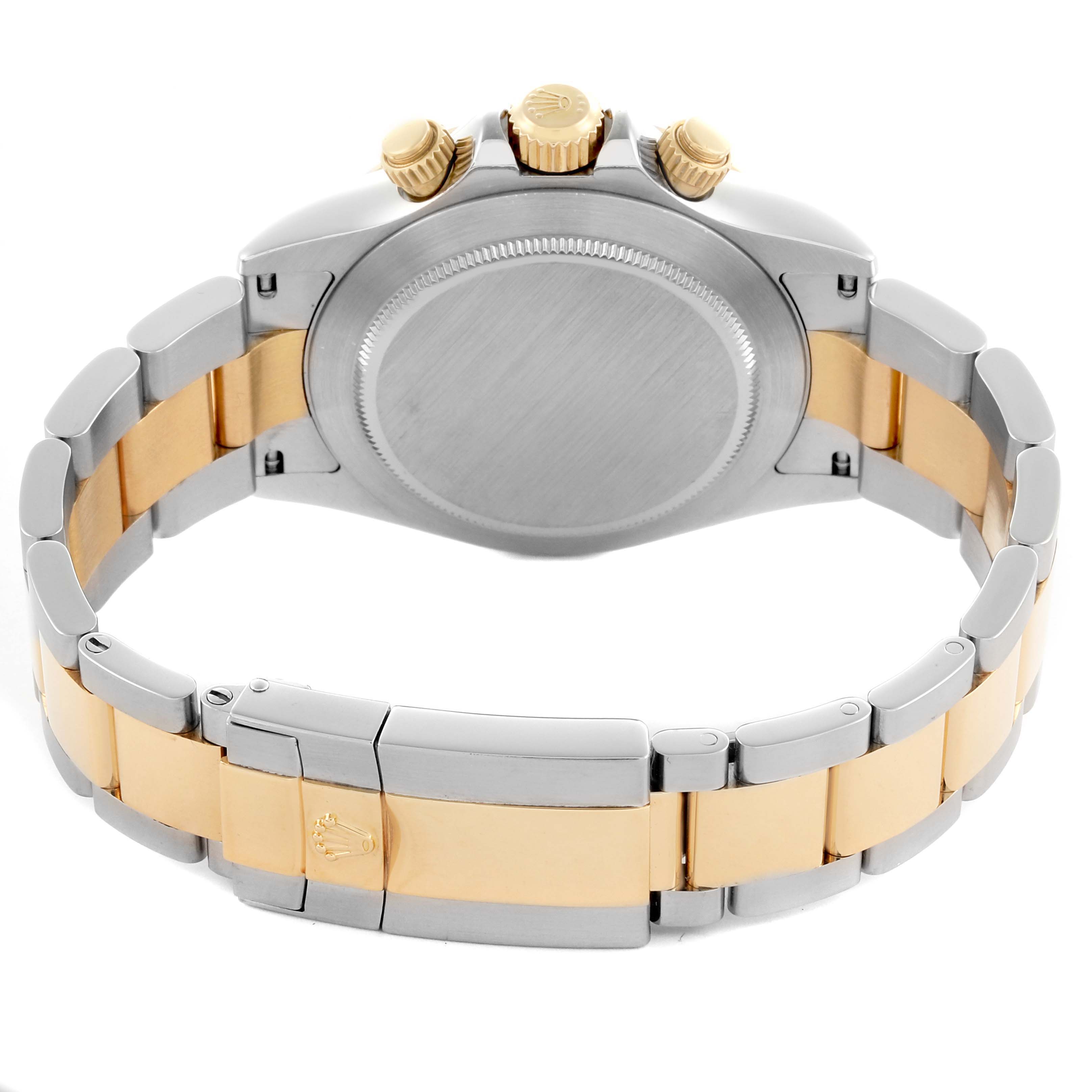 The image shows the back view of a Rolex Daytona 116523 Men
s Steel and Gold (two tone) White Dial 116523 Men
s Steel and Gold (two tone) White Dial, highlighting its clasp, bracelet, and crown side.