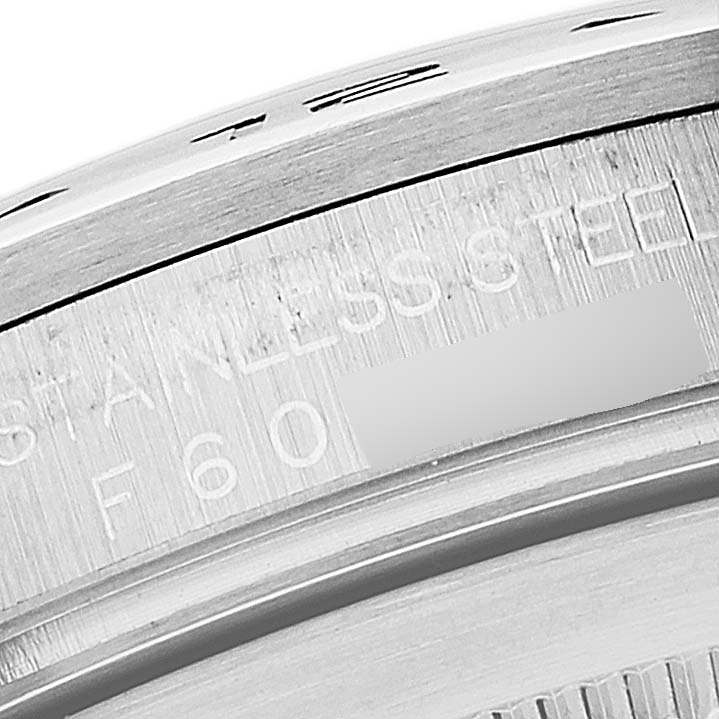 This image shows a close-up of the side casing of a Rolex Explorer 16570 Men's Stainless Steel Black Dial 16570 Men's Stainless Steel Black Dial watch, highlighting the "STAINLESS STEEL" engraving.