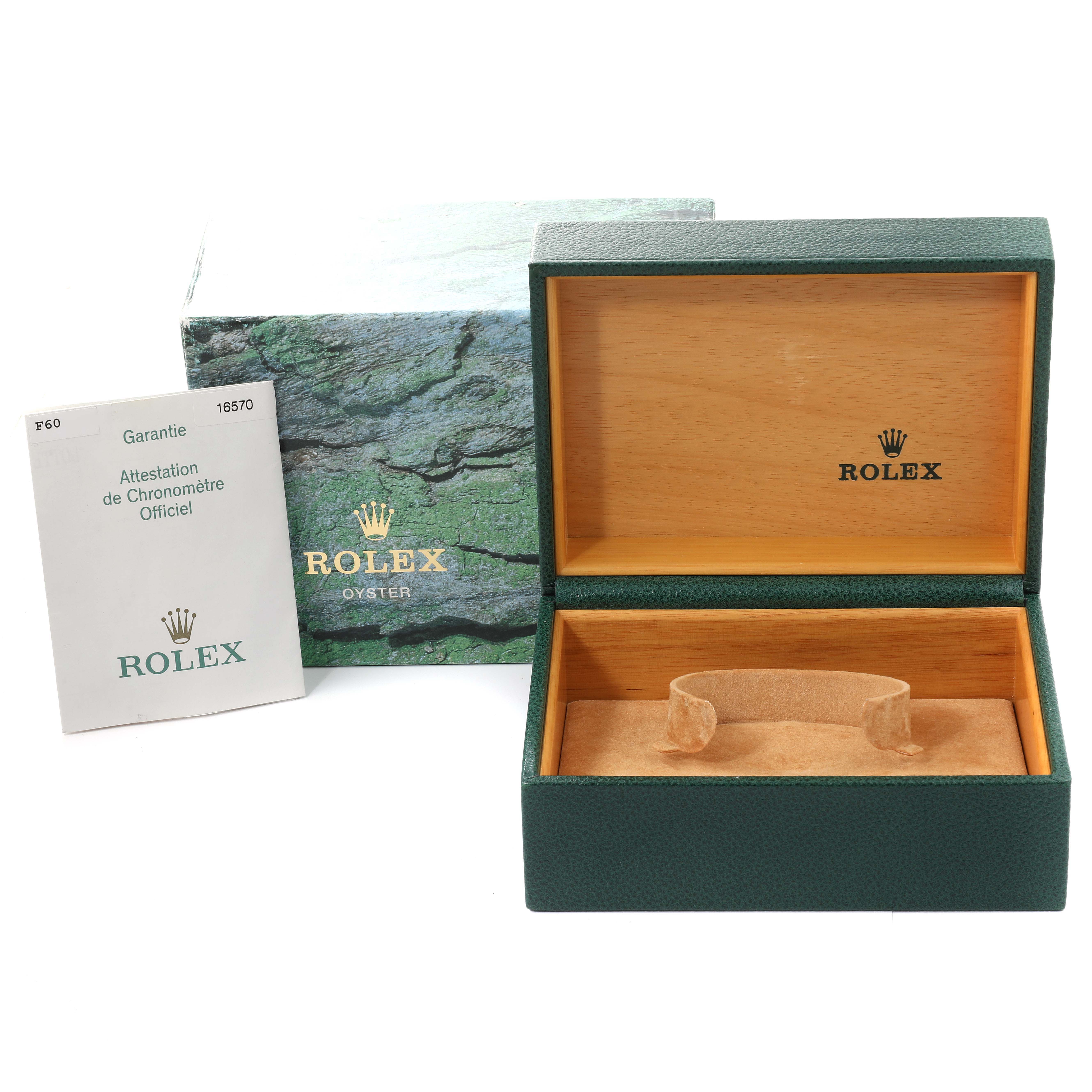 The image shows an open Rolex box for the Explorer model, a warranty card, and an outer green box.