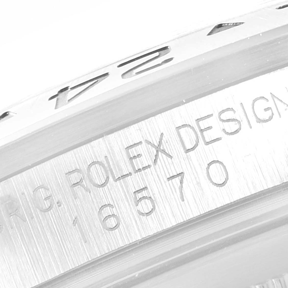 This image shows a close-up of the bezel and engraved serial number on a Rolex Explorer 16570 Men
s Stainless Steel White Dial 16570 Men
s Stainless Steel White Dial watch.