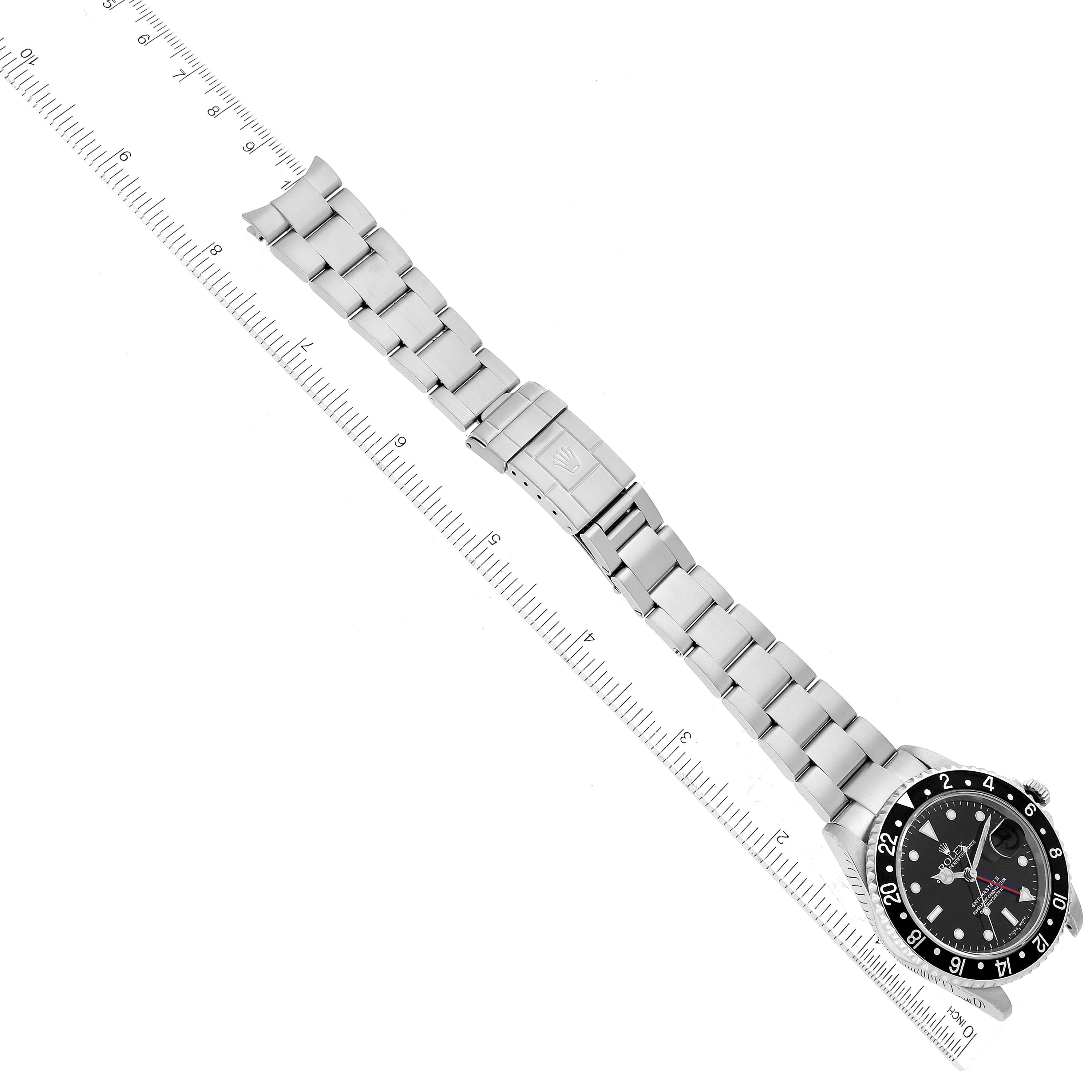 The image shows a top-down view of a Rolex GMT-Master M16710LN Men
s Stainless Steel Black Dial M16710LN Men
s Stainless Steel Black Dial watch, focusing on the bracelet and clasp.