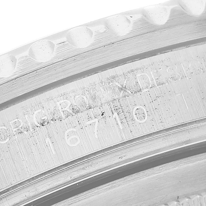 The image shows an angled close-up of the serial and reference numbers on the side case of a Rolex GMT-Master M16710LN Men
s Stainless Steel Black Dial M16710LN Men
s Stainless Steel Black Dial watch.