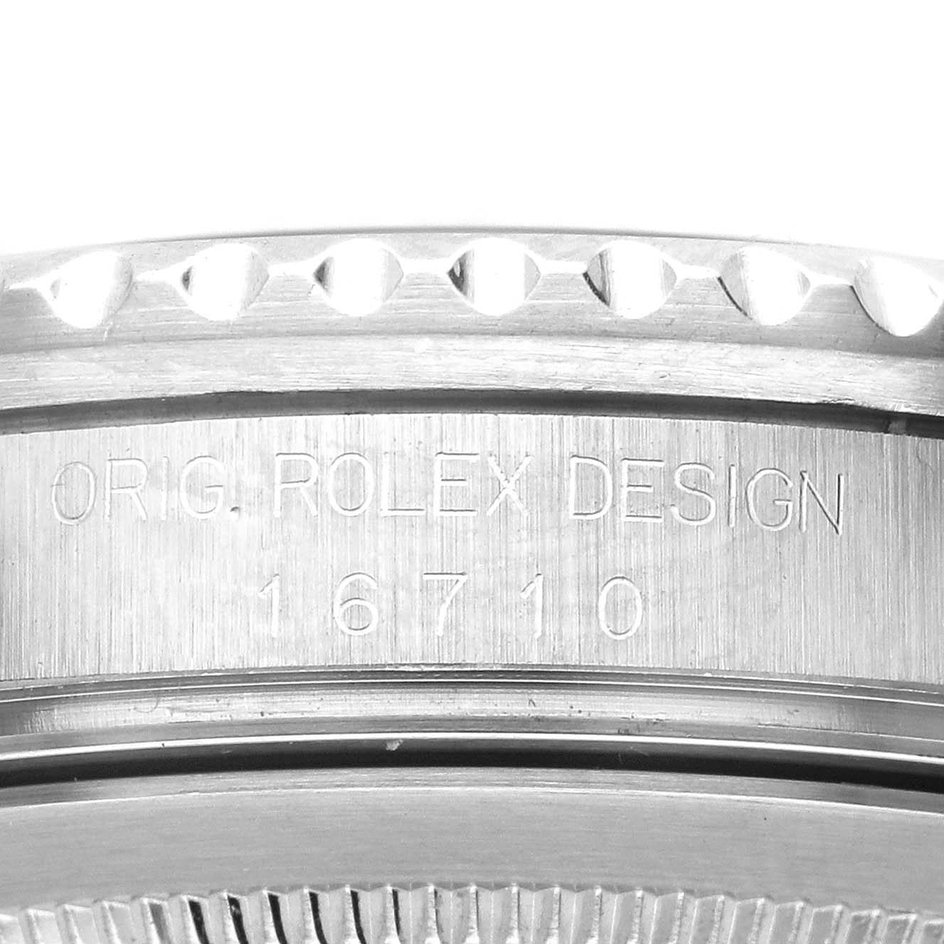 The image shows a close-up of the side of the Rolex GMT-Master 16710 Men's Stainless Steel Black Dial 16710 Men's Stainless Steel Black Dial, highlighting the engraved model number "16710" and "Orig. Rolex Design."