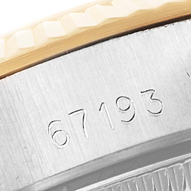 The image shows the serial number on the side of the case of a Rolex Oyster Perpetual 67193 Women
s Steel and Gold (two tone) Champagne Dial 67193 Women
s Steel and Gold (two tone) Champagne Dial watch.