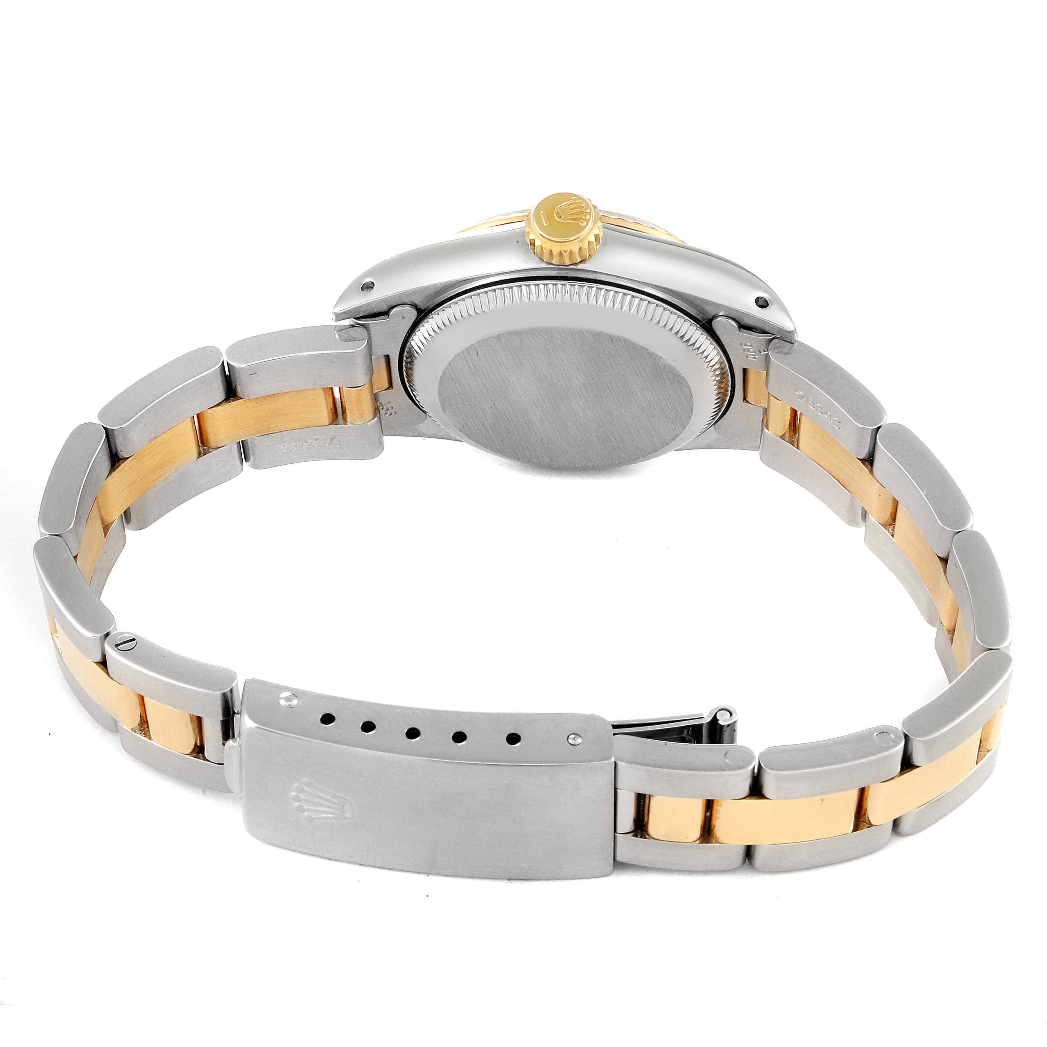 This image shows the back case and bracelet clasp of the Rolex Oyster Perpetual 67193 Women
s Steel and Gold (two tone) Champagne Dial 67193 Women
s Steel and Gold (two tone) Champagne Dial watch in a two-tone metal finish.