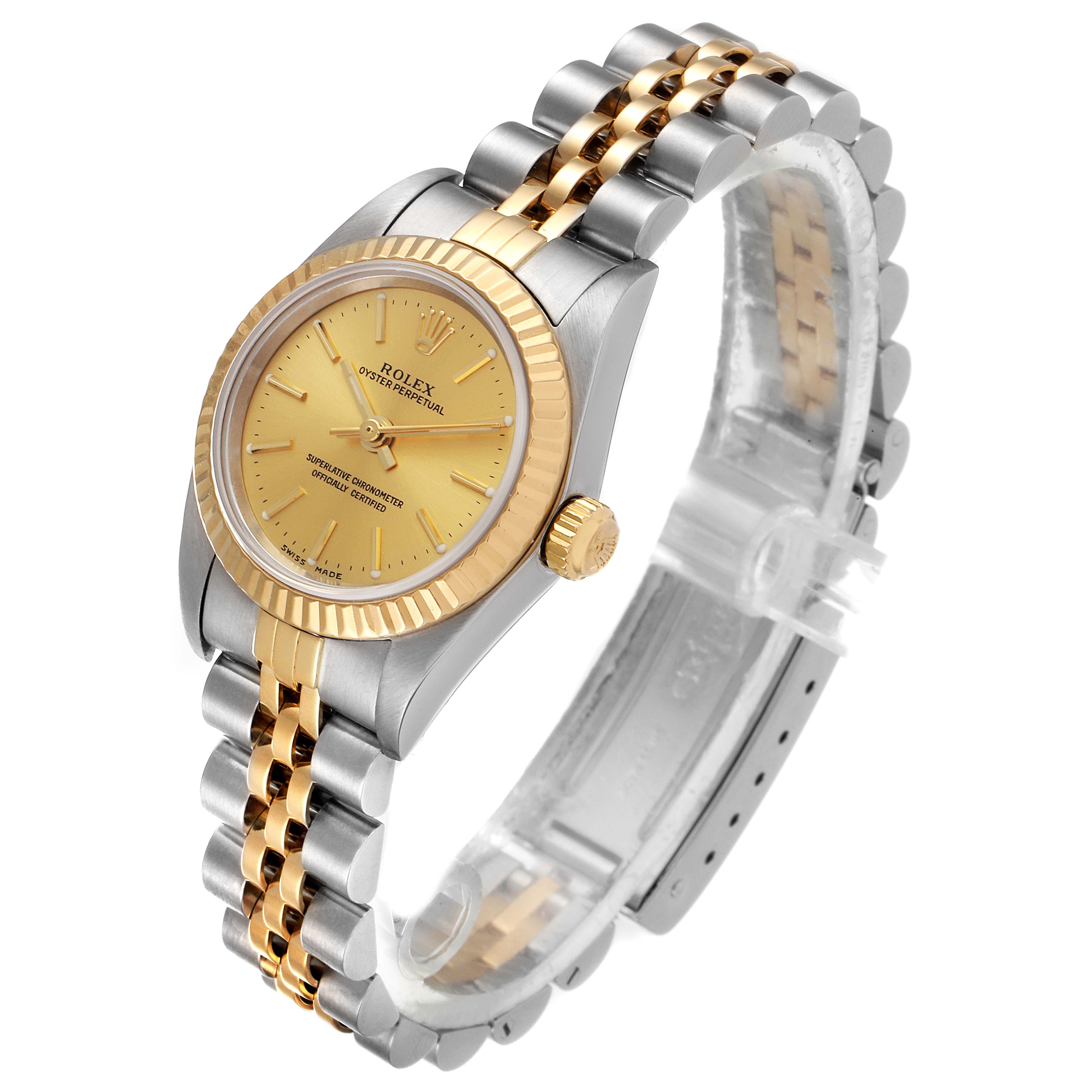 This image shows a Rolex Oyster Perpetual 76193 Women
s Steel and Gold (two tone) Champagne Dial 76193 Women
s Steel and Gold (two tone) Champagne Dial watch at a three-quarter angle, highlighting its face, bezel, crown, and two-tone bracelet.