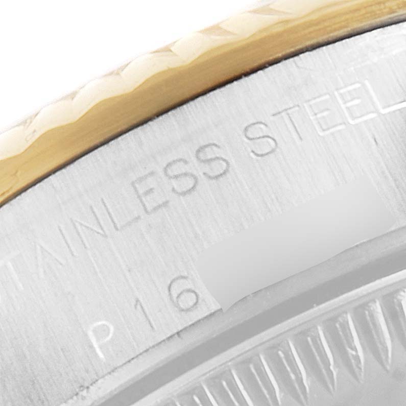 Close-up of the stainless steel casing and gold bezel of a Rolex Oyster Perpetual 76193 Women
s Steel and Gold (two tone) Champagne Dial 76193 Women
s Steel and Gold (two tone) Champagne Dial watch.