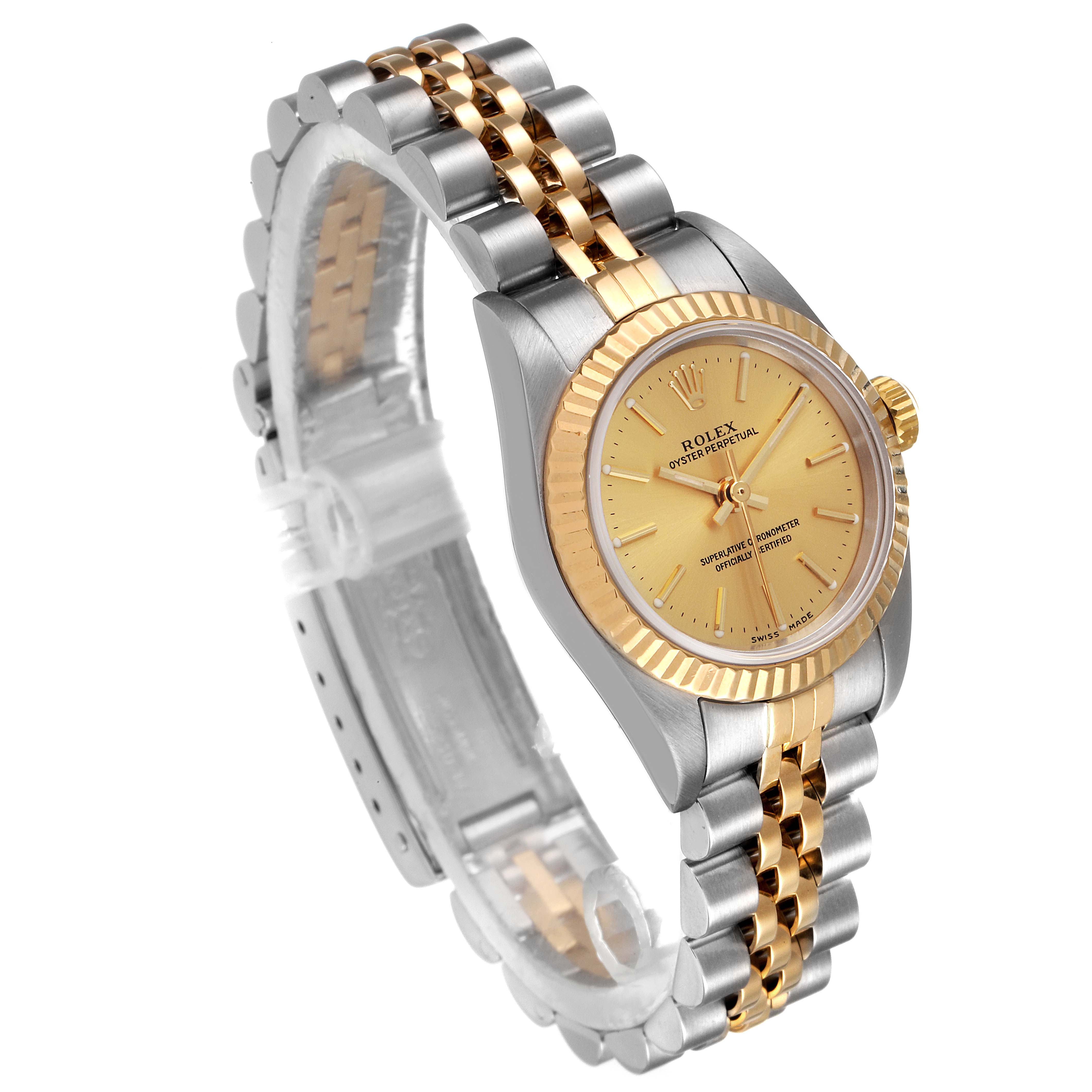 This image shows a side angle of the Rolex Oyster Perpetual 76193 Women
s Steel and Gold (two tone) Champagne Dial 76193 Women
s Steel and Gold (two tone) Champagne Dial watch, highlighting its two-tone bracelet and gold dial.