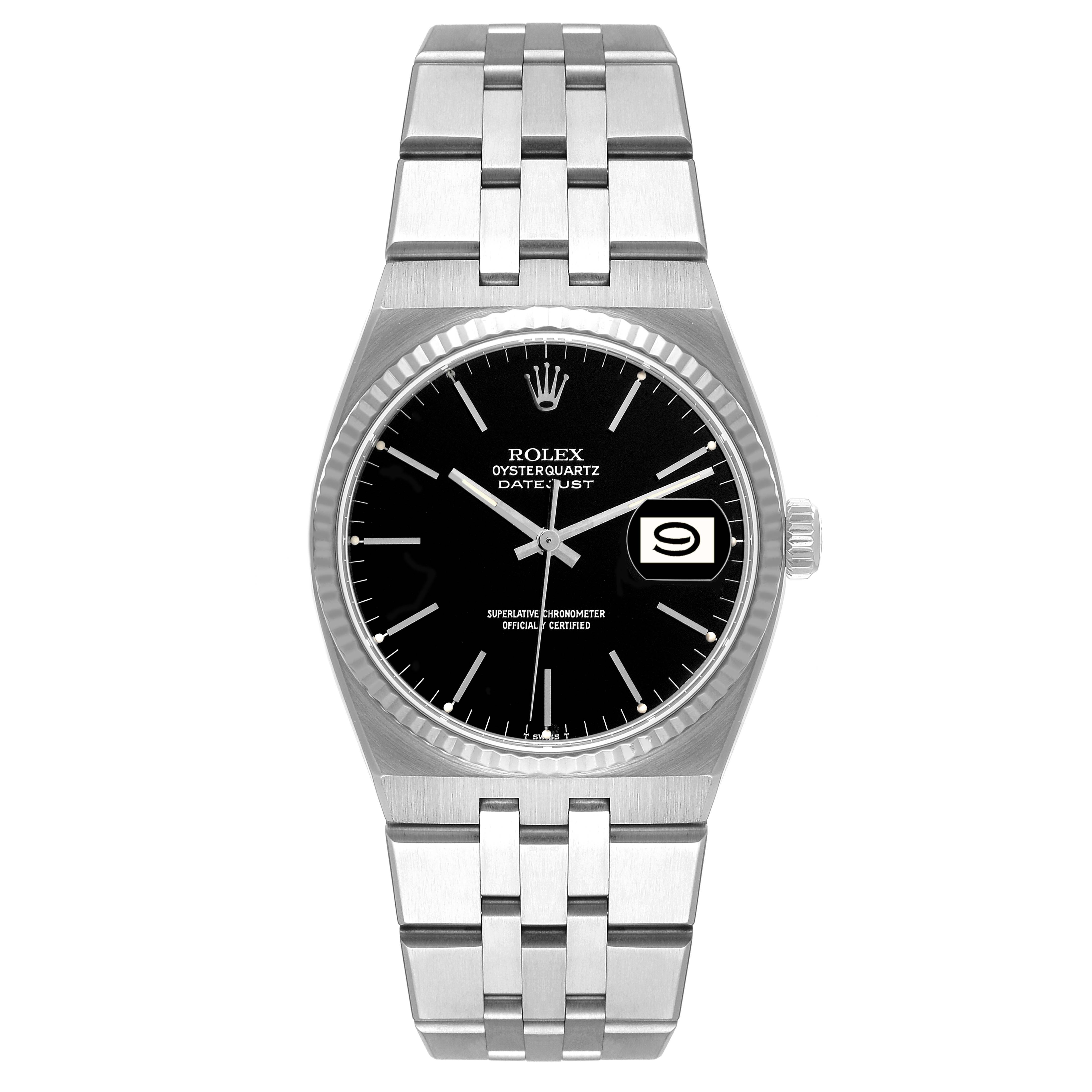 This image shows a Rolex Oysterquartz 17014 Men's Stainless Steel Black Dial 17014 Men's Stainless Steel Black Dial Datejust watch from a top-down angle, displaying its black dial, bracelet, and crown.