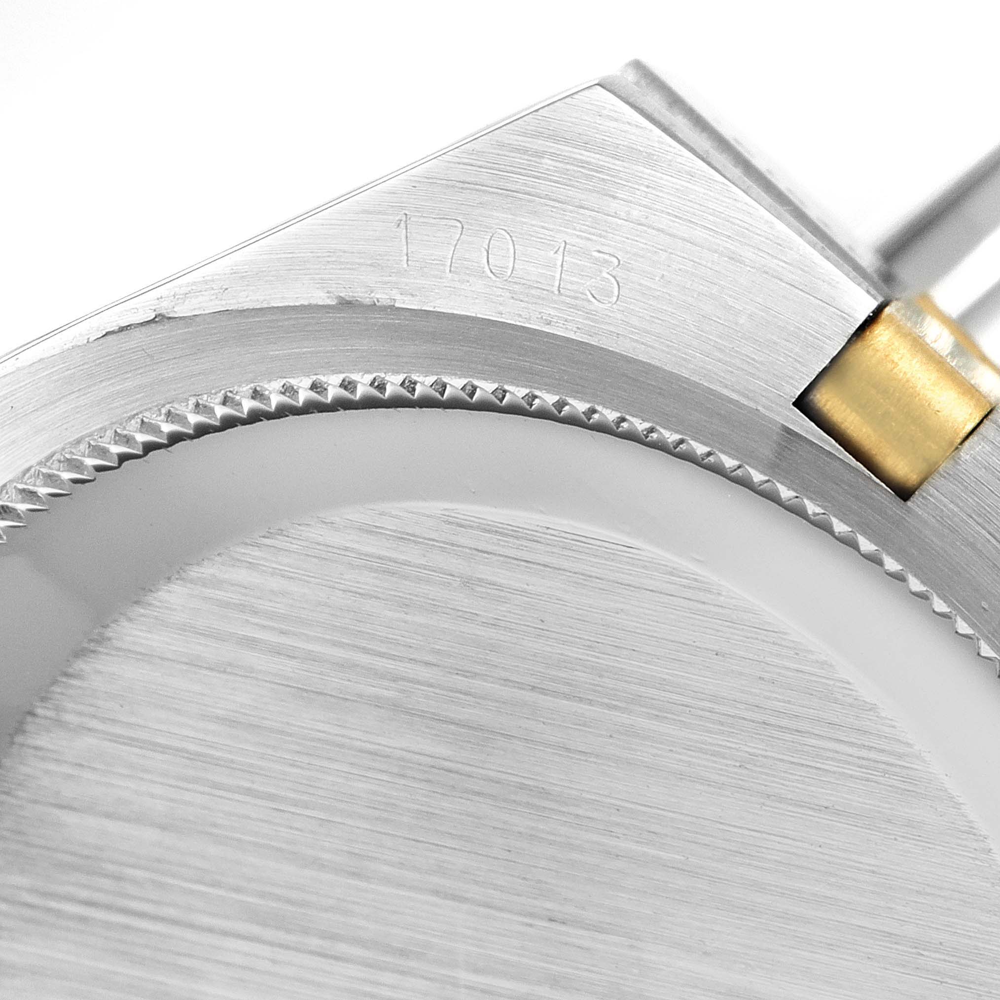 This image shows a close-up of the bezel, lugs, and part of the bracelet of a Rolex Oysterquartz 17013 Men's Steel and Gold (two tone) White Dial 17013 Men's Steel and Gold (two tone) White Dial model 17013.
