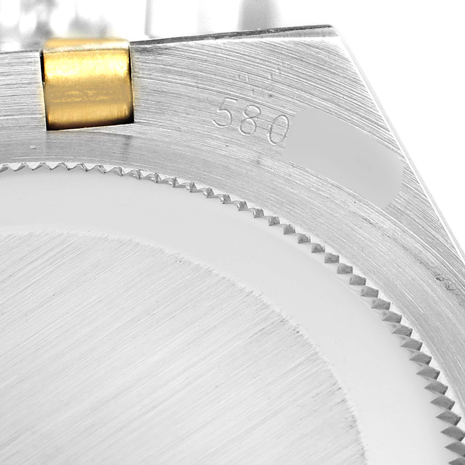 The image shows a close-up of the case and bracelet link of a Rolex Oysterquartz 17013 Men's Steel and Gold (two tone) White Dial 17013 Men's Steel and Gold (two tone) White Dial model, focusing on the metal texture and part number 580.