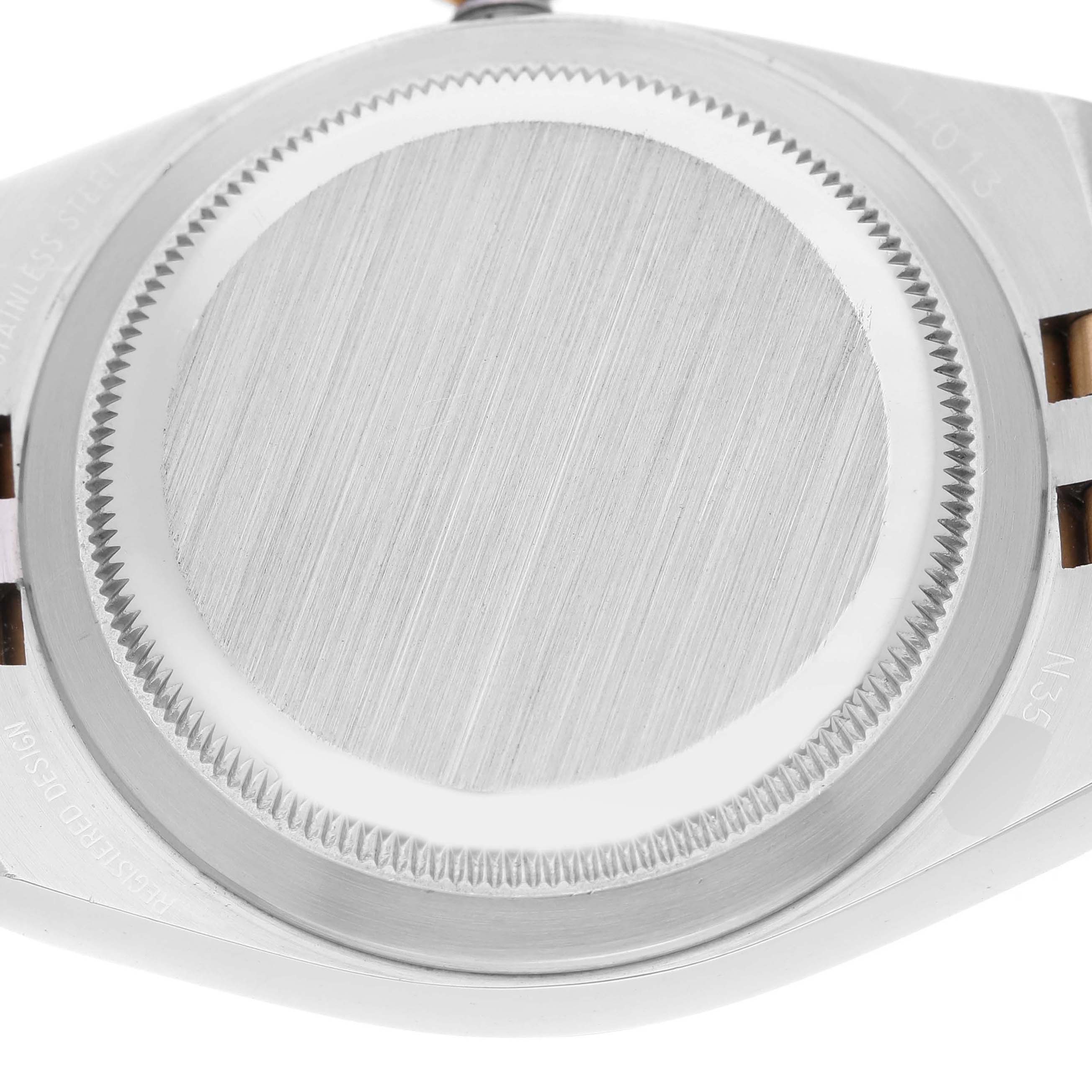 Up-close view of the back case of the Rolex Oysterquartz 17013 Men
s Steel and Gold (two tone) Champagne Dial 17013 Men
s Steel and Gold (two tone) Champagne Dial model, showing the brushed finish and screws.