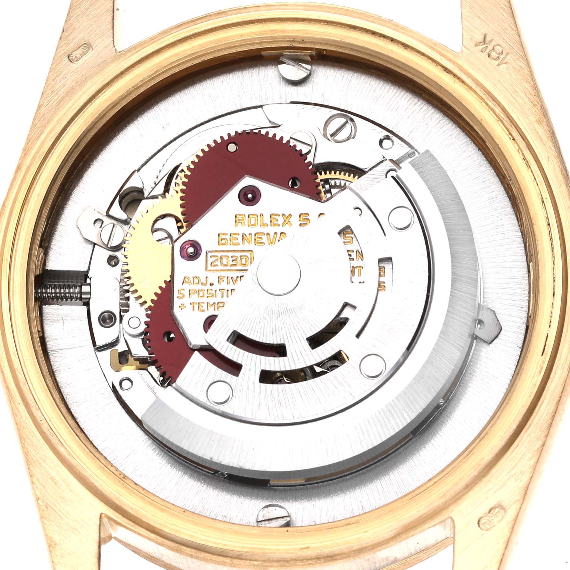 The image shows the movement of a Rolex President 6824 Women's Yellow Gold White Dial 6824 Women's Yellow Gold White Dial model from the back, highlighting gears and components.