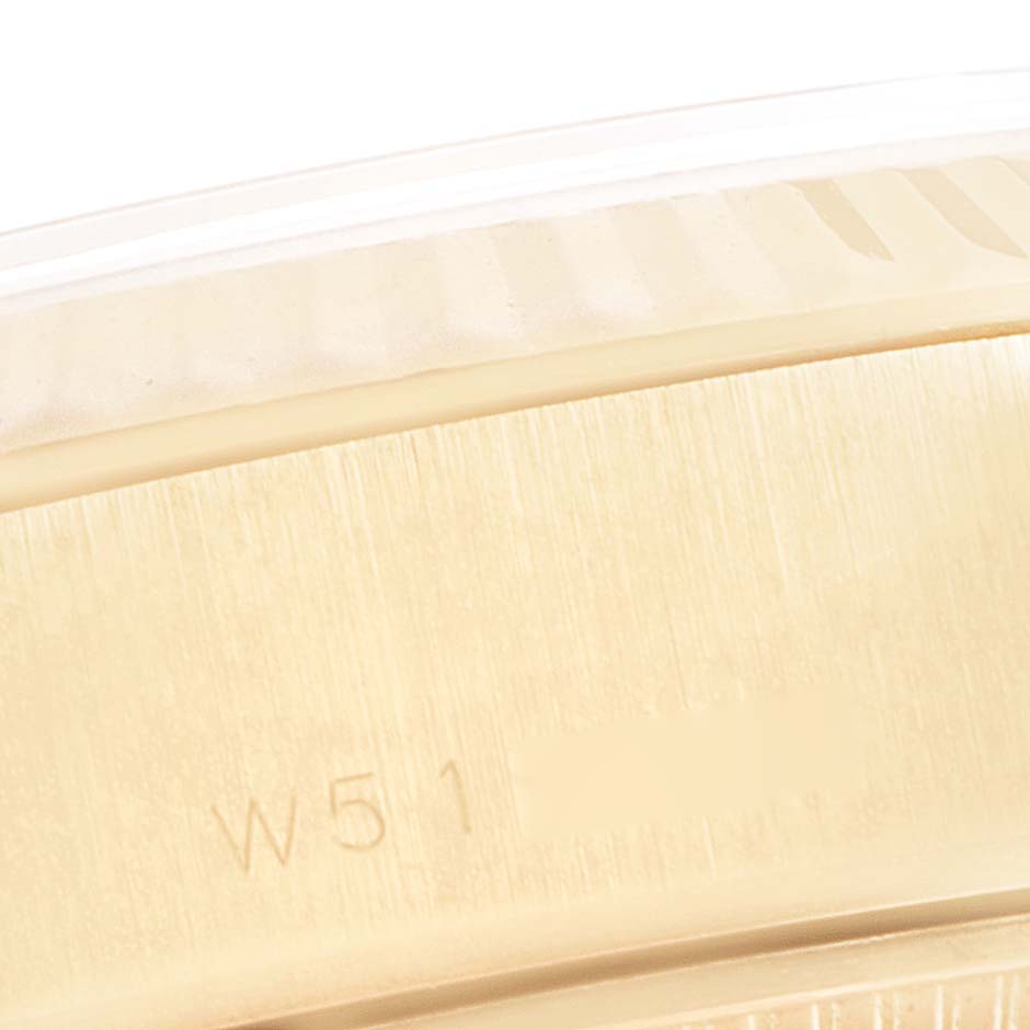 This close-up image shows a partial view of the bezel and case of a Rolex President 69178 Women
s Yellow Gold Champagne Dial 69178 Women
s Yellow Gold Champagne Dial model watch.