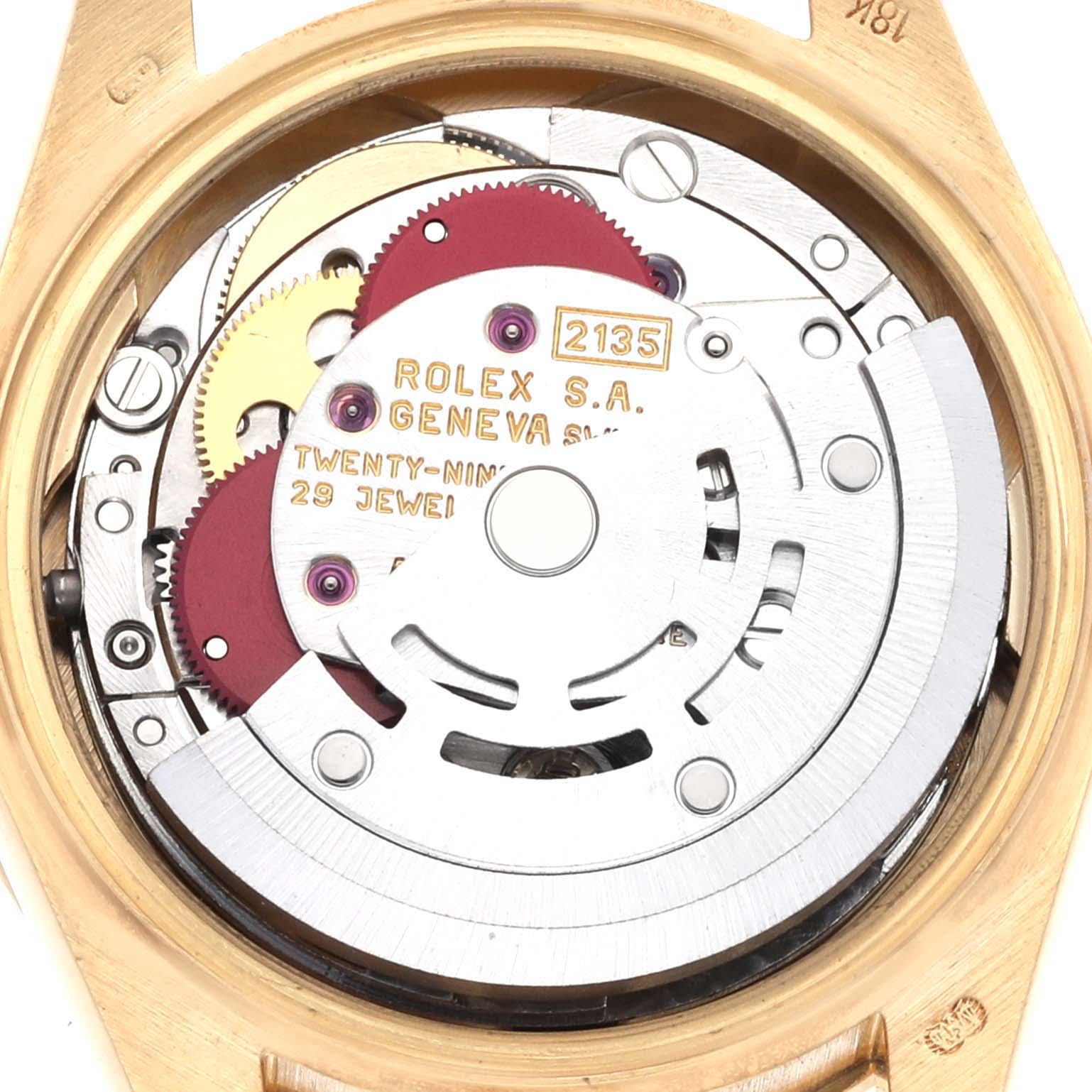 The image shows the movement of a Rolex President 69138 Women's Yellow Gold Champagne Dial 69138 Women's Yellow Gold Champagne Dial watch from the back, highlighting gears and jewels.