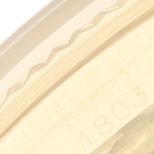 This close-up shows the engraved edge and bezel of a Rolex President 1803 Men
s Yellow Gold Champagne Dial 1803 Men
s Yellow Gold Champagne Dial model watch.