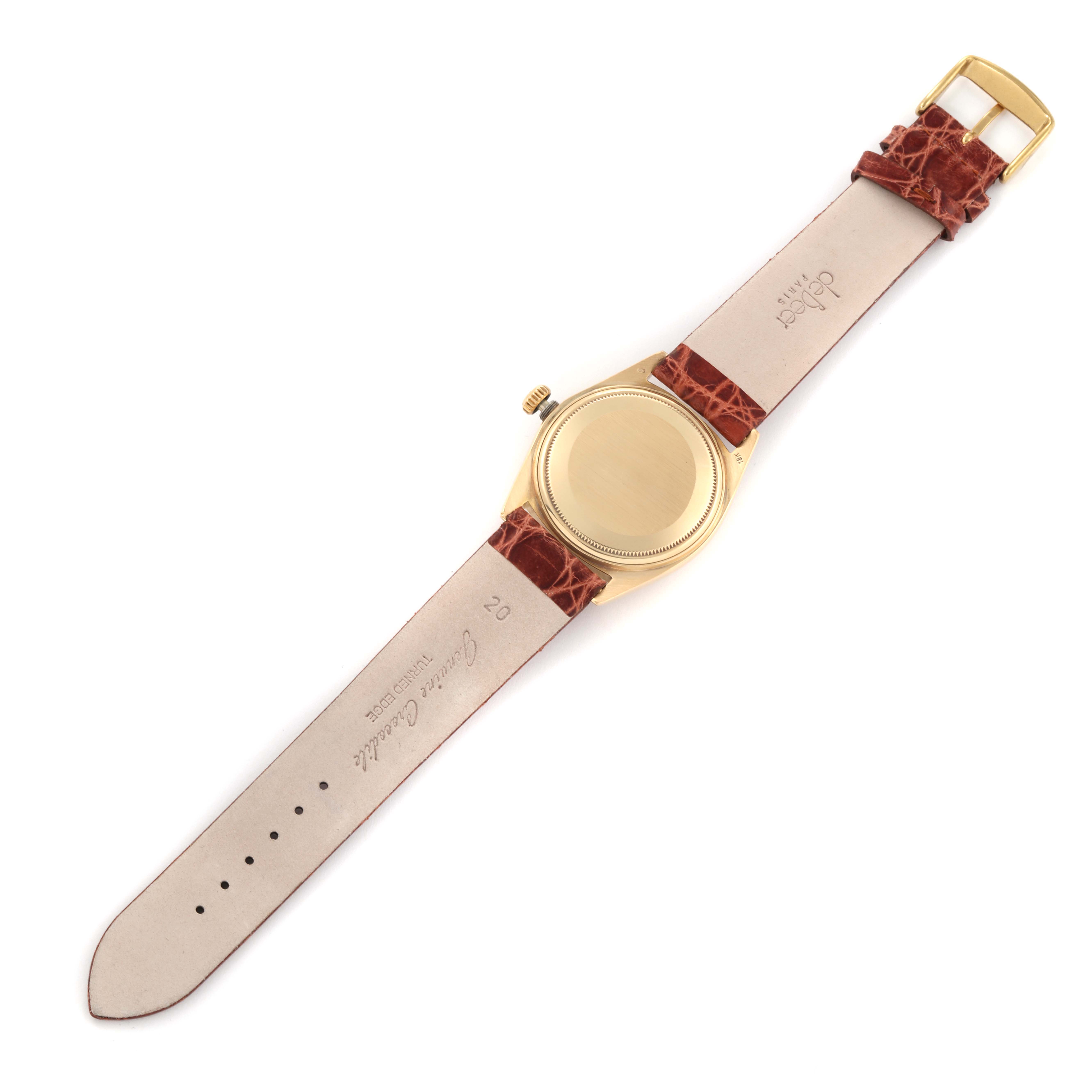 The image shows the back side and strap of a Rolex President 1803 Men
s Yellow Gold Champagne Dial 1803 Men
s Yellow Gold Champagne Dial model watch, including the case, crown, and leather band.