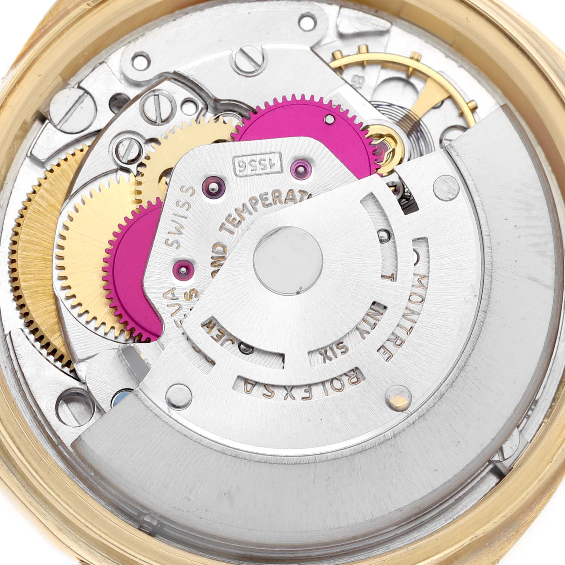 The image shows a close-up of the internal mechanisms and movement of a Rolex President 1803 Men
s Yellow Gold Champagne Dial 1803 Men
s Yellow Gold Champagne Dial model watch.