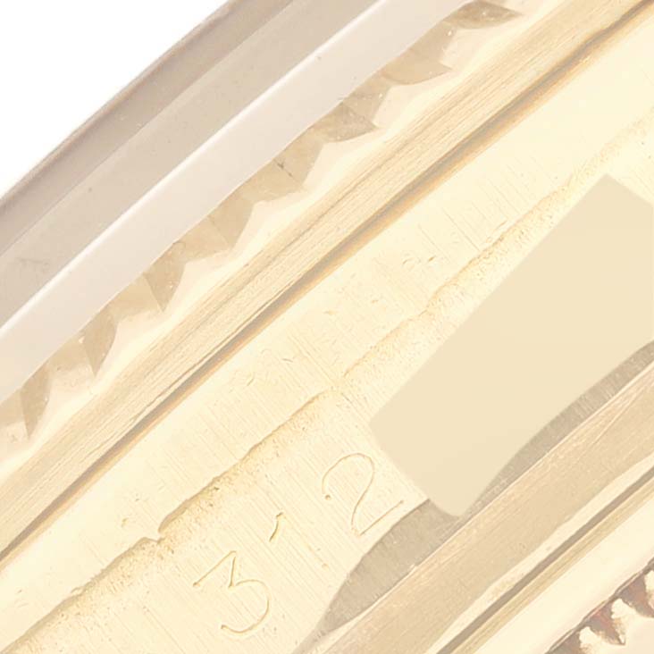 This close-up image shows a portion of the bezel and case of the Rolex President 1803 Men
s Yellow Gold Champagne Dial 1803 Men
s Yellow Gold Champagne Dial model.