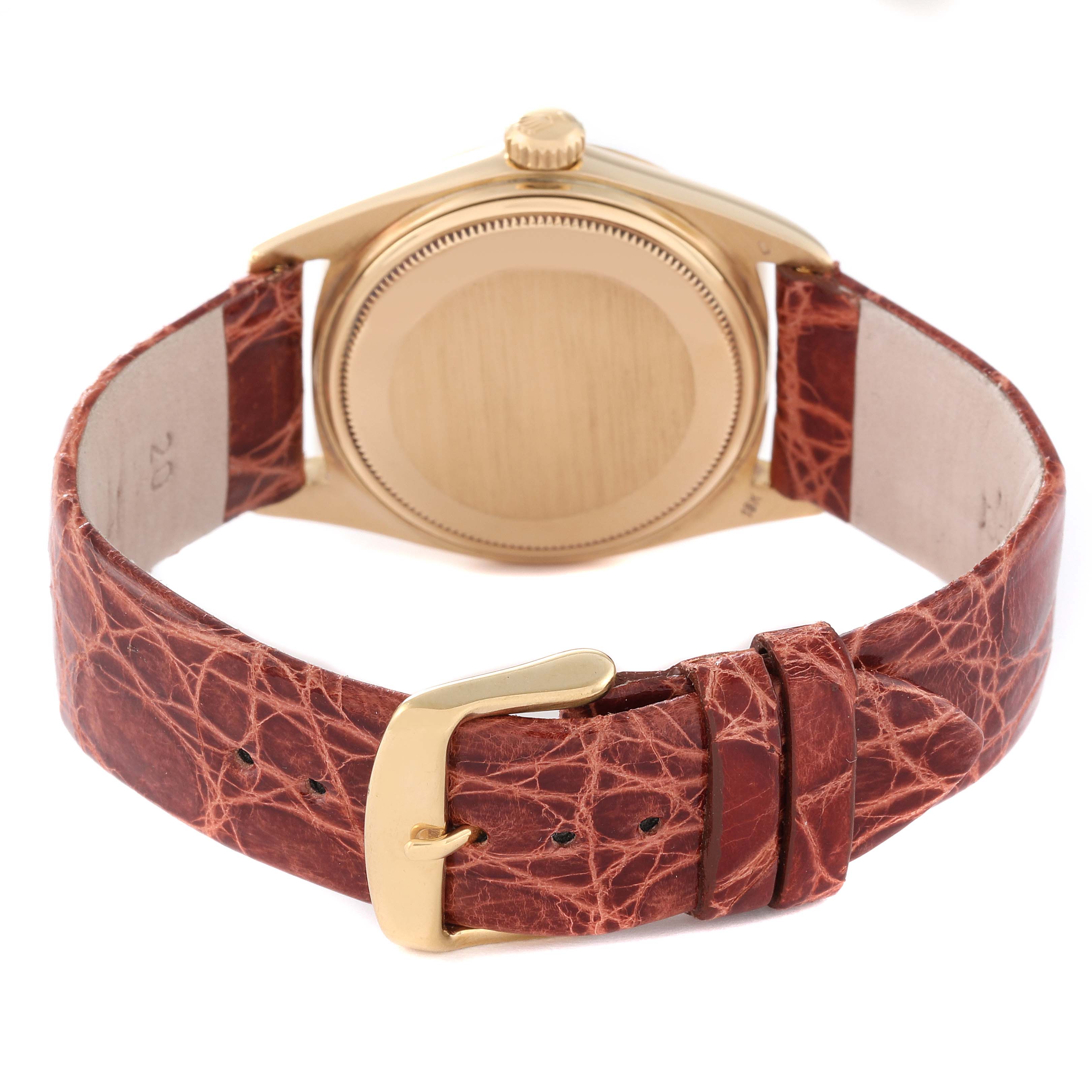 The image shows the back of a Rolex President 1803 Men
s Yellow Gold Champagne Dial 1803 Men
s Yellow Gold Champagne Dial model watch, highlighting the case, crown, and leather strap with a buckle.