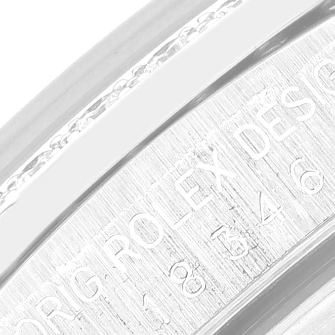 This close-up image of the Rolex President 18346 Men's Platinum Blue Dial 18346 Men's Platinum Blue Dial model shows the engraved text on the inner bezel.