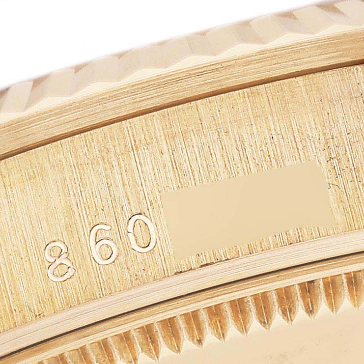 This close-up image shows the serial number and part of the bezel of a Rolex President 68278 Women's Yellow Gold White Dial 68278 Women's Yellow Gold White Dial model watch.