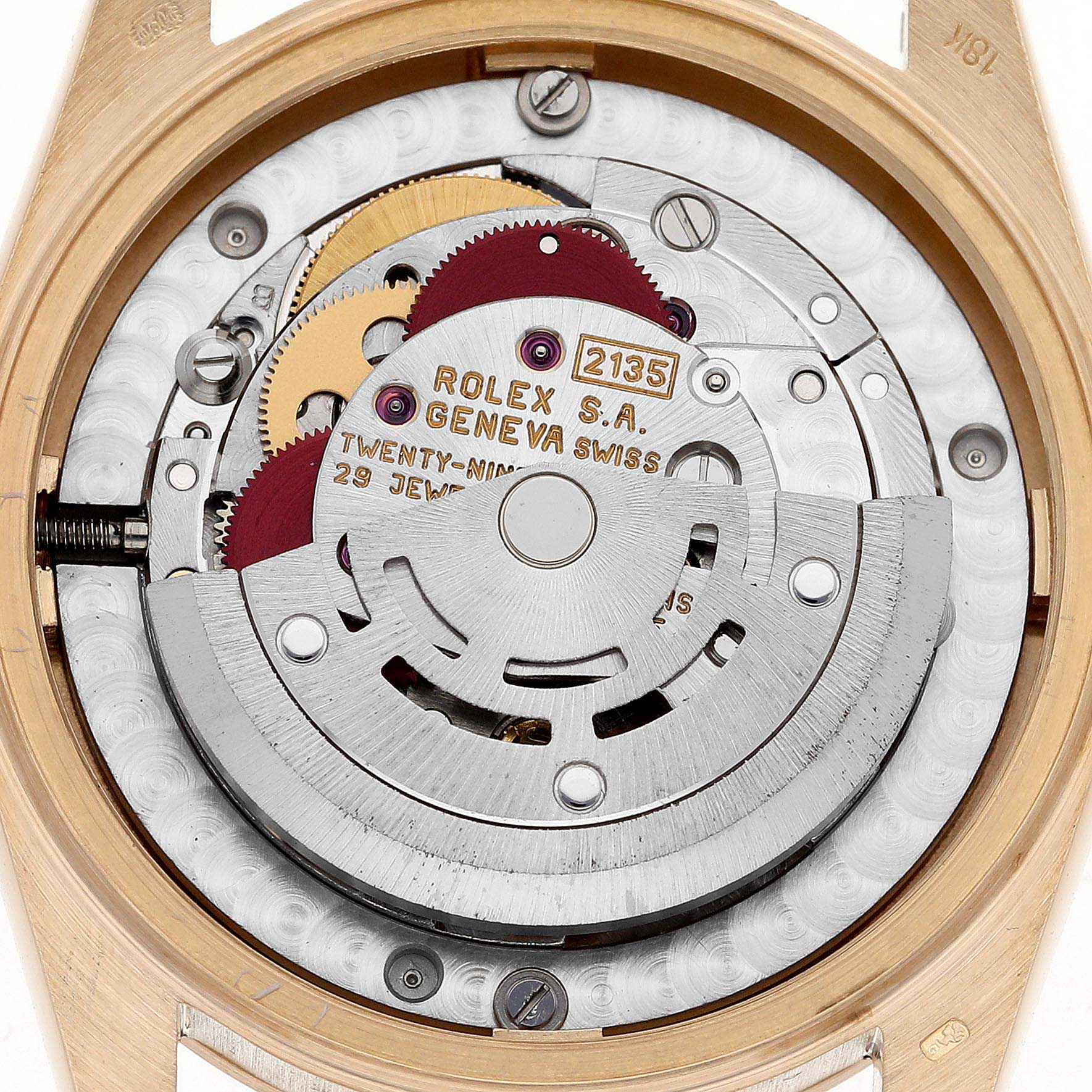The image shows the inner mechanical movement of a Rolex President 68278 Women's Yellow Gold White Dial 68278 Women's Yellow Gold White Dial model watch, highlighting its intricate gears and components.