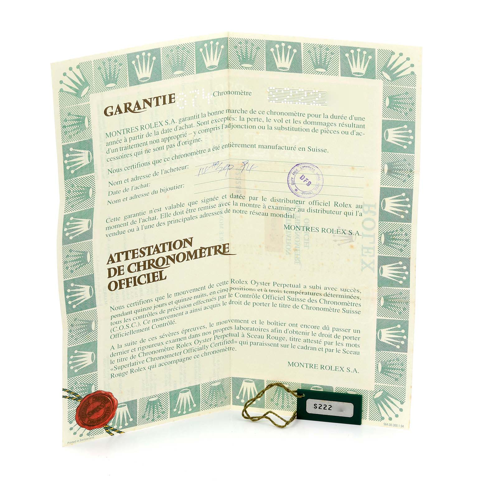 The image shows a Rolex President 69178 Women's Yellow Gold Black Dial 69178 Women's Yellow Gold Black Dial model warranty and chronometer certificate from an overhead angle.