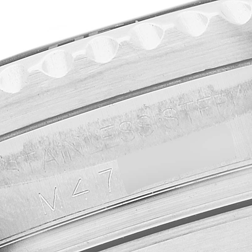 The image shows a close-up of the bezel and part of the case of a Rolex Sea-Dweller 16600T Men's Stainless Steel Black Dial 16600T Men's Stainless Steel Black Dial watch, highlighting the engraving.