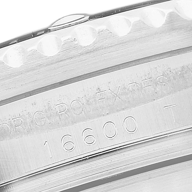 This image shows a close-up of the engraved bezel and case side of a Rolex Sea-Dweller 16600T Men's Stainless Steel Black Dial 16600T Men's Stainless Steel Black Dial model 16600.