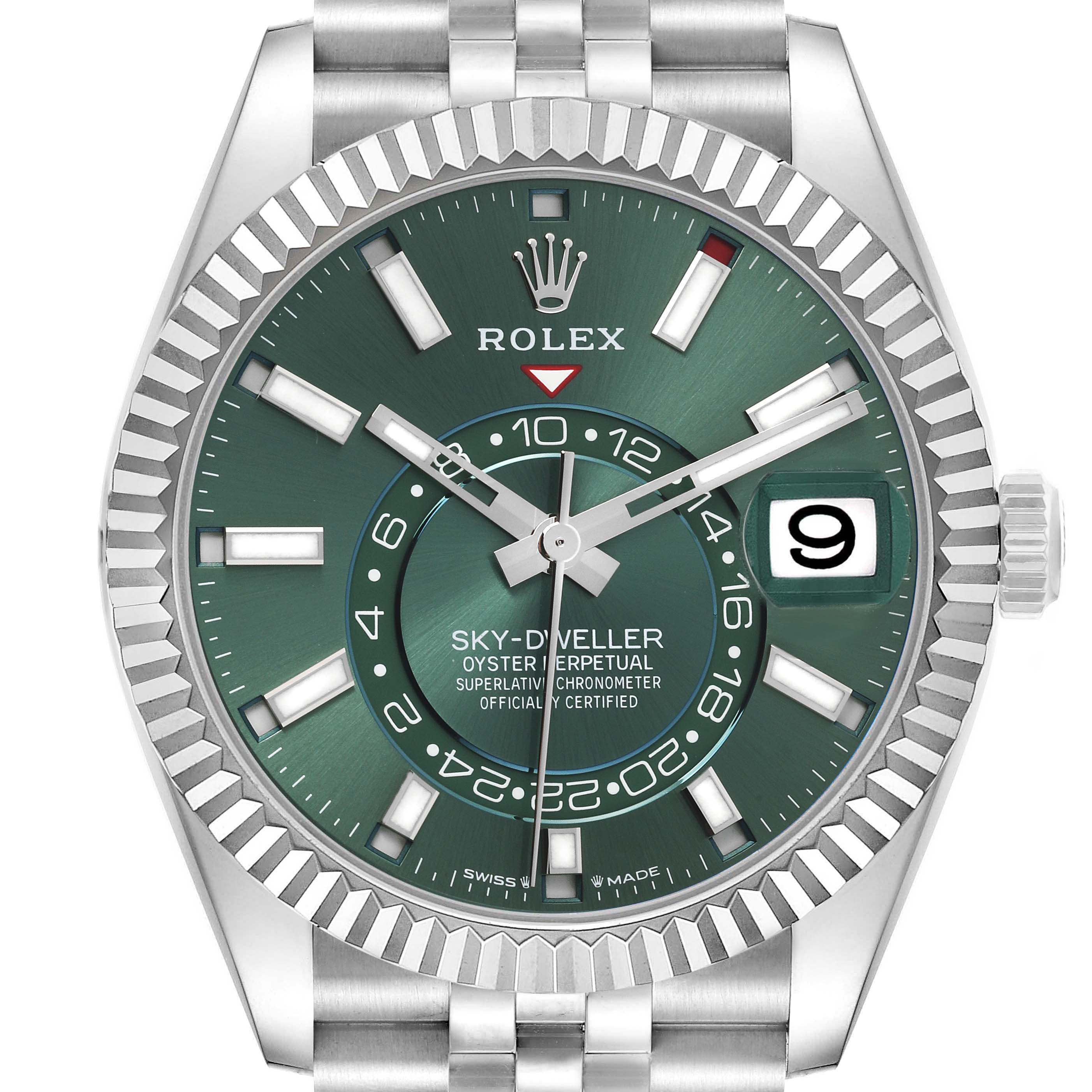 The Rolex Sky-Dweller 336934 Men
s Steel and Gold (two tone) Green Dial 336934 Men
s Steel and Gold (two tone) Green Dial watch is shown from a front angle, displaying its green dial, date window, fluted bezel, and bracelet.