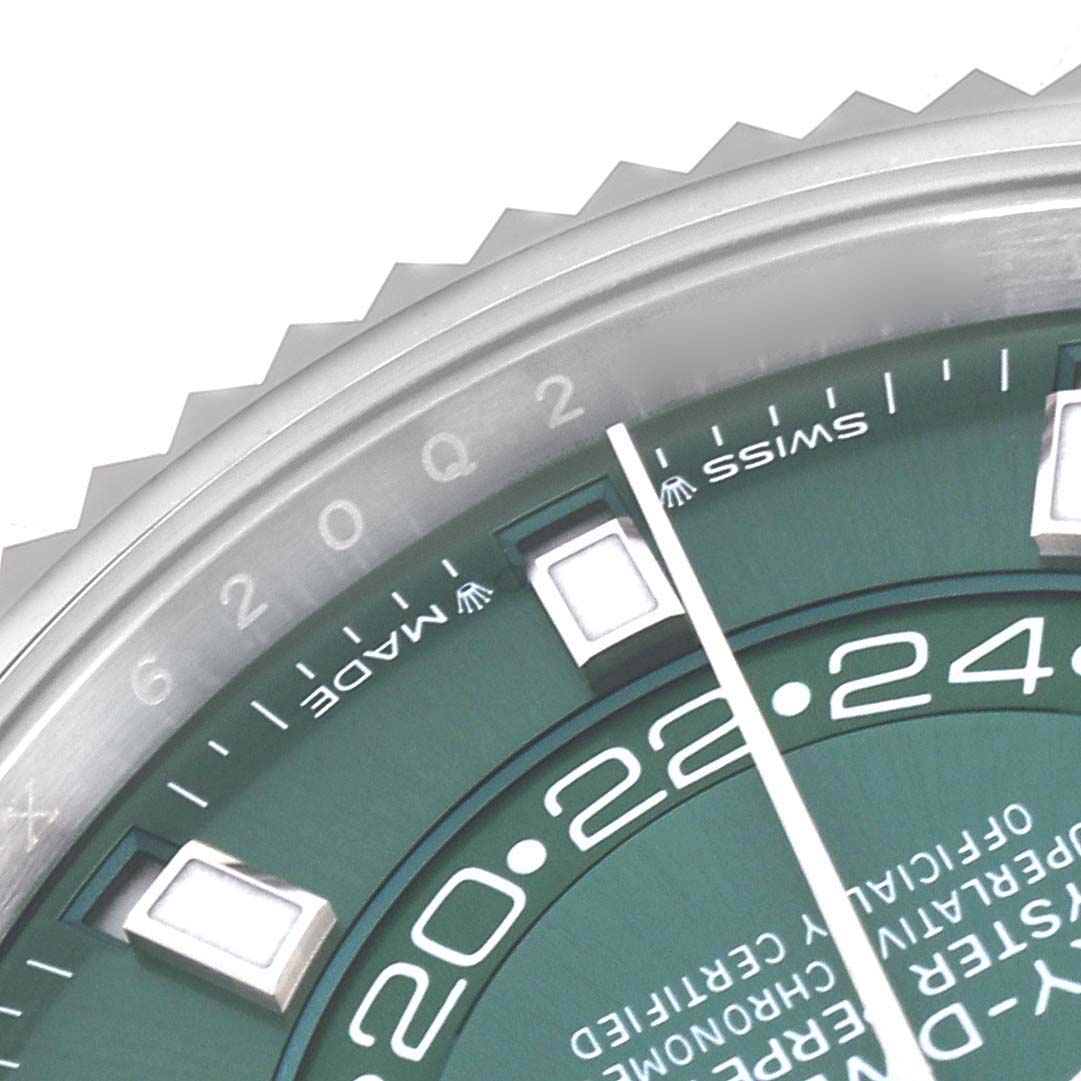 The image shows a close-up of the Rolex Sky-Dweller 336934 Men
s Stainless Steel Green Dial 336934 Men
s Stainless Steel Green Dial
s dial, bezel, and hour markers at an oblique angle.