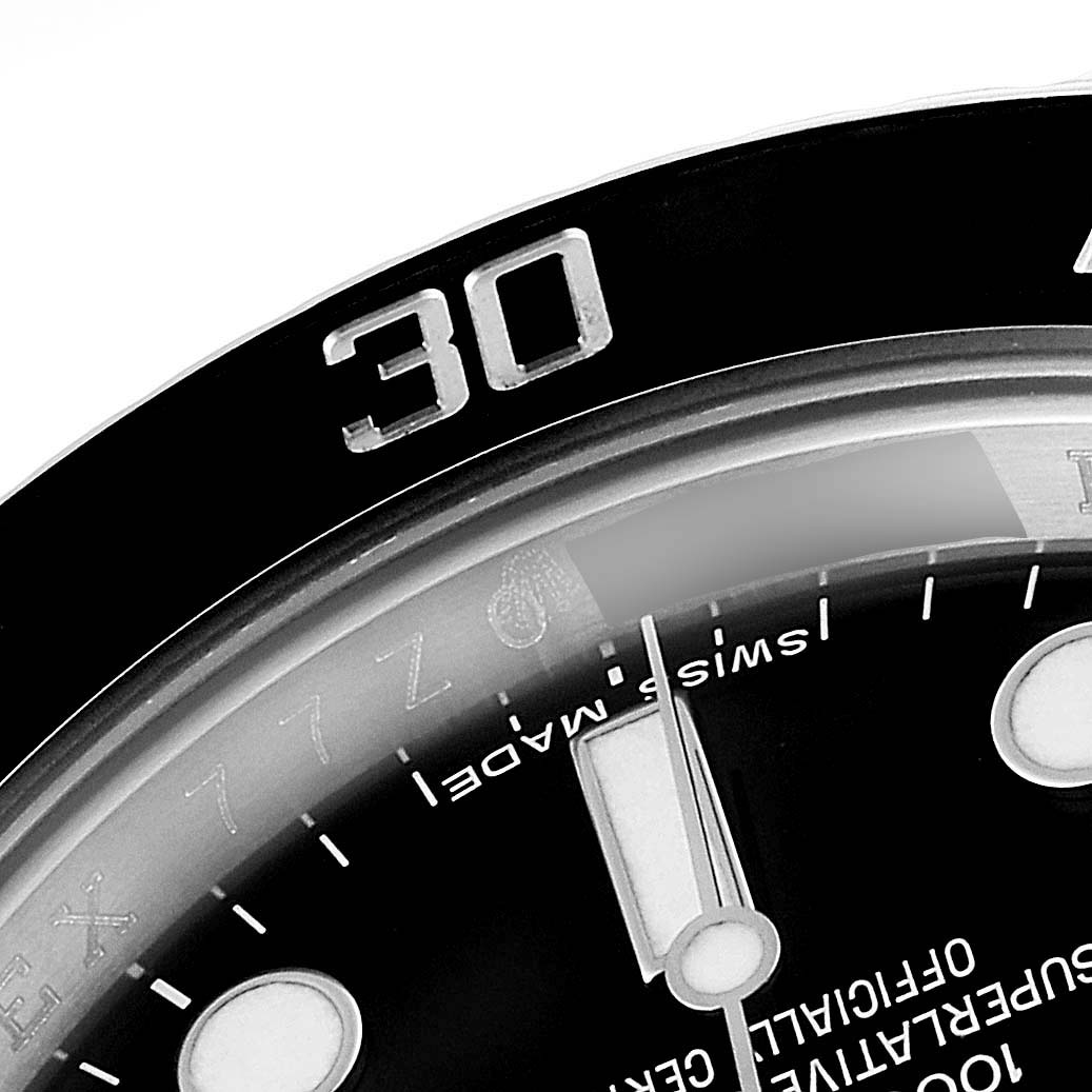 The image shows a close-up of the bezel, dial, and minute hand of a Rolex Submariner 114060 Men's Stainless Steel Black Dial 114060 Men's Stainless Steel Black Dial watch, highlighting the "30" marker.