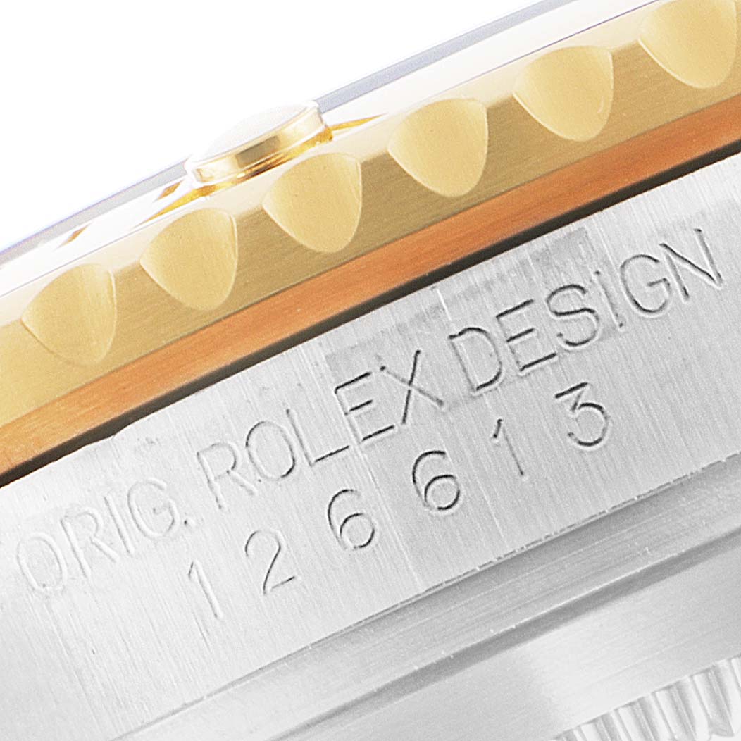This image shows a close-up of the case side of a Rolex Submariner 126613 Men
s Steel and Gold (two tone) Blue Dial 126613 Men
s Steel and Gold (two tone) Blue Dial, highlighting the bezel and engraved model number 126613.