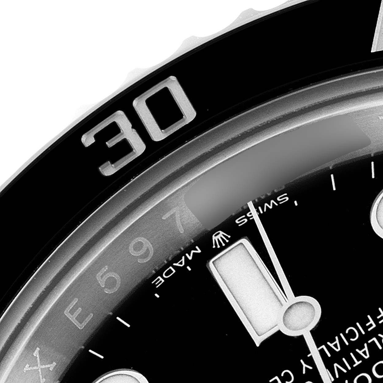 The image shows a close-up of the bezel and dial of a Rolex Submariner 124060 Men
s Stainless Steel Black Dial 124060 Men
s Stainless Steel Black Dial, specifically the area around the 30-minute mark.