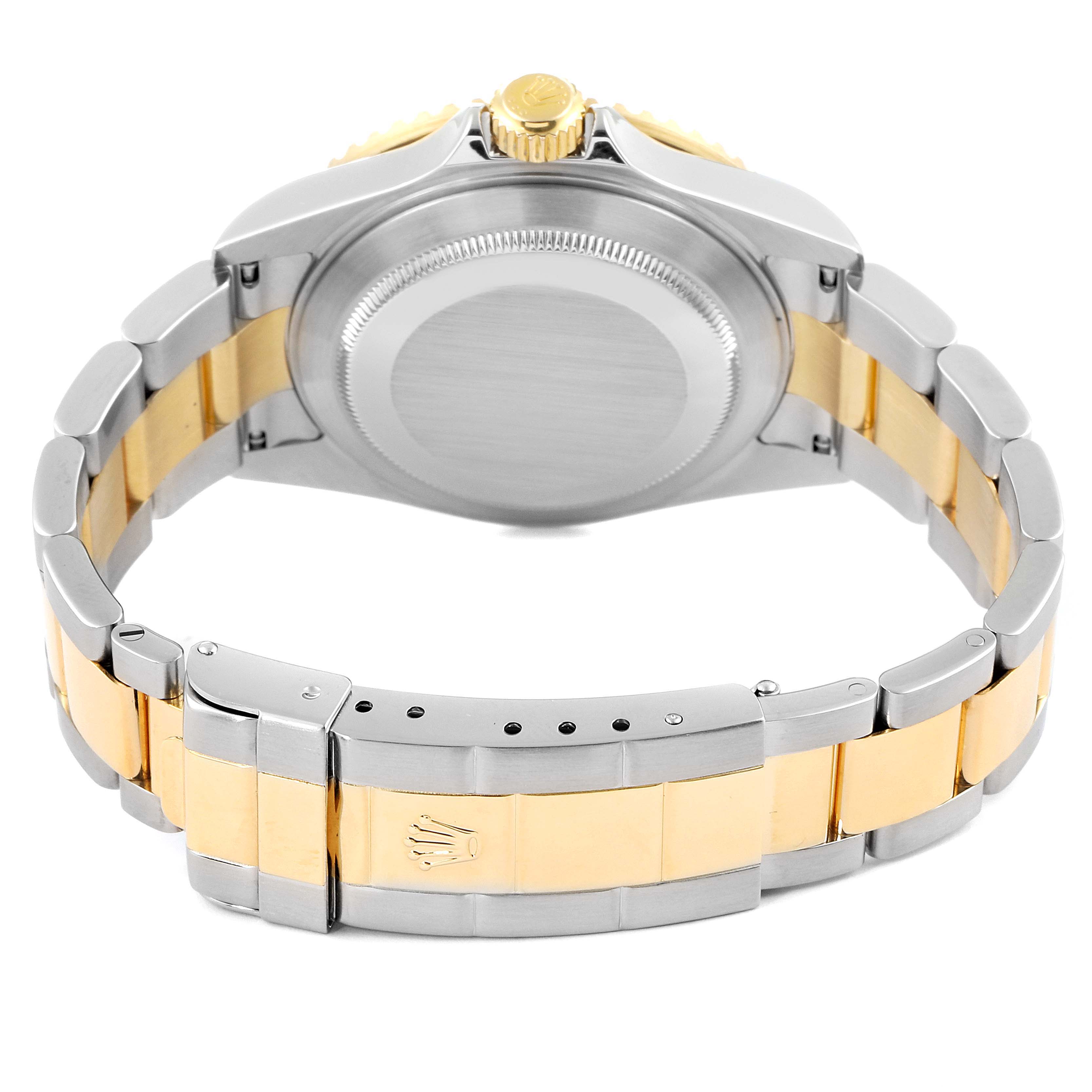 This image shows the back view of a Rolex Submariner 16613 Men's Steel and Gold (two tone) Blue Dial 16613 Men's Steel and Gold (two tone) Blue Dial watch, highlighting its two-tone bracelet and clasp.