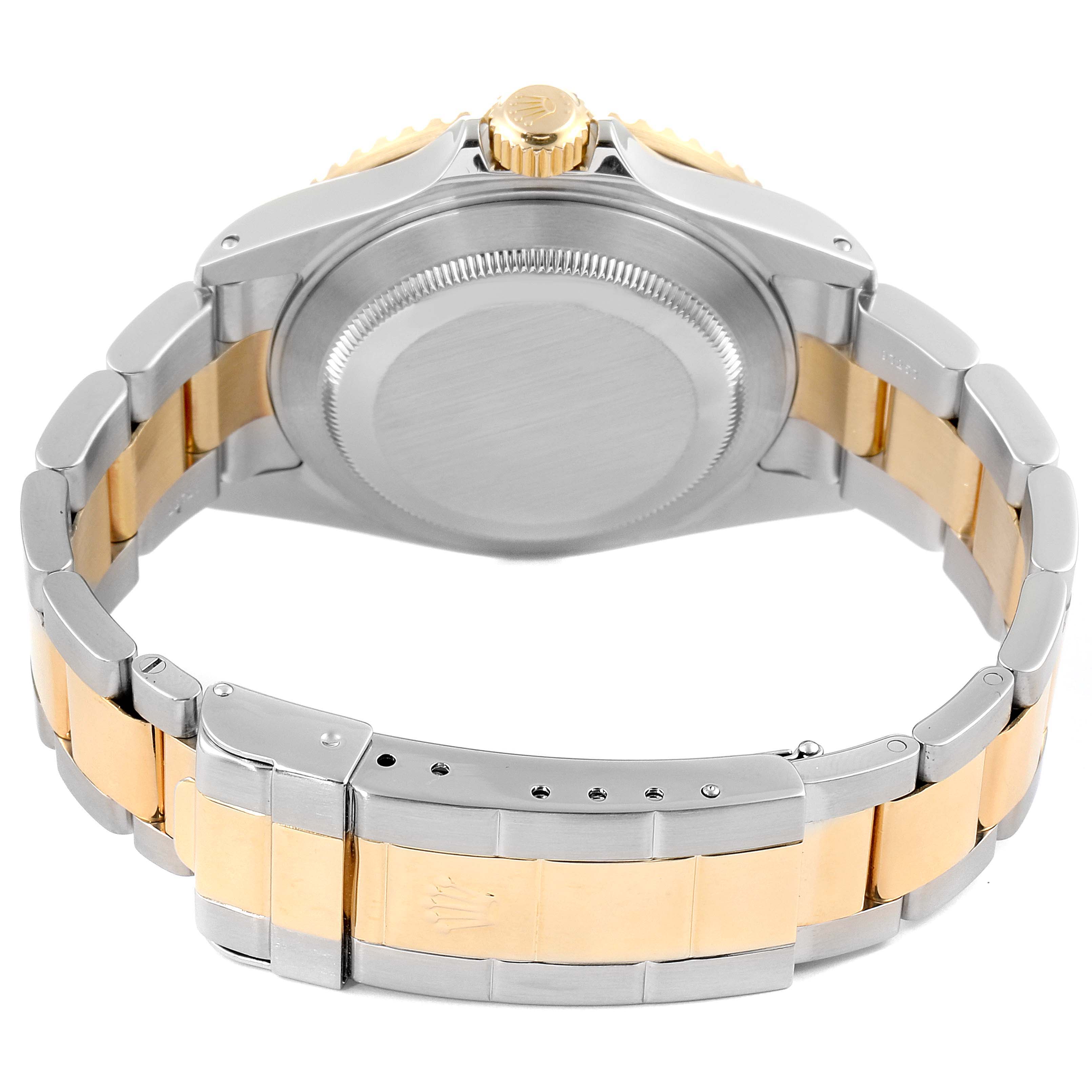 The image shows the back view and bracelet of a Rolex Submariner 16613 Men's Steel and Gold (two tone) Blue Dial 16613 Men's Steel and Gold (two tone) Blue Dial watch in a two-tone metal finish.