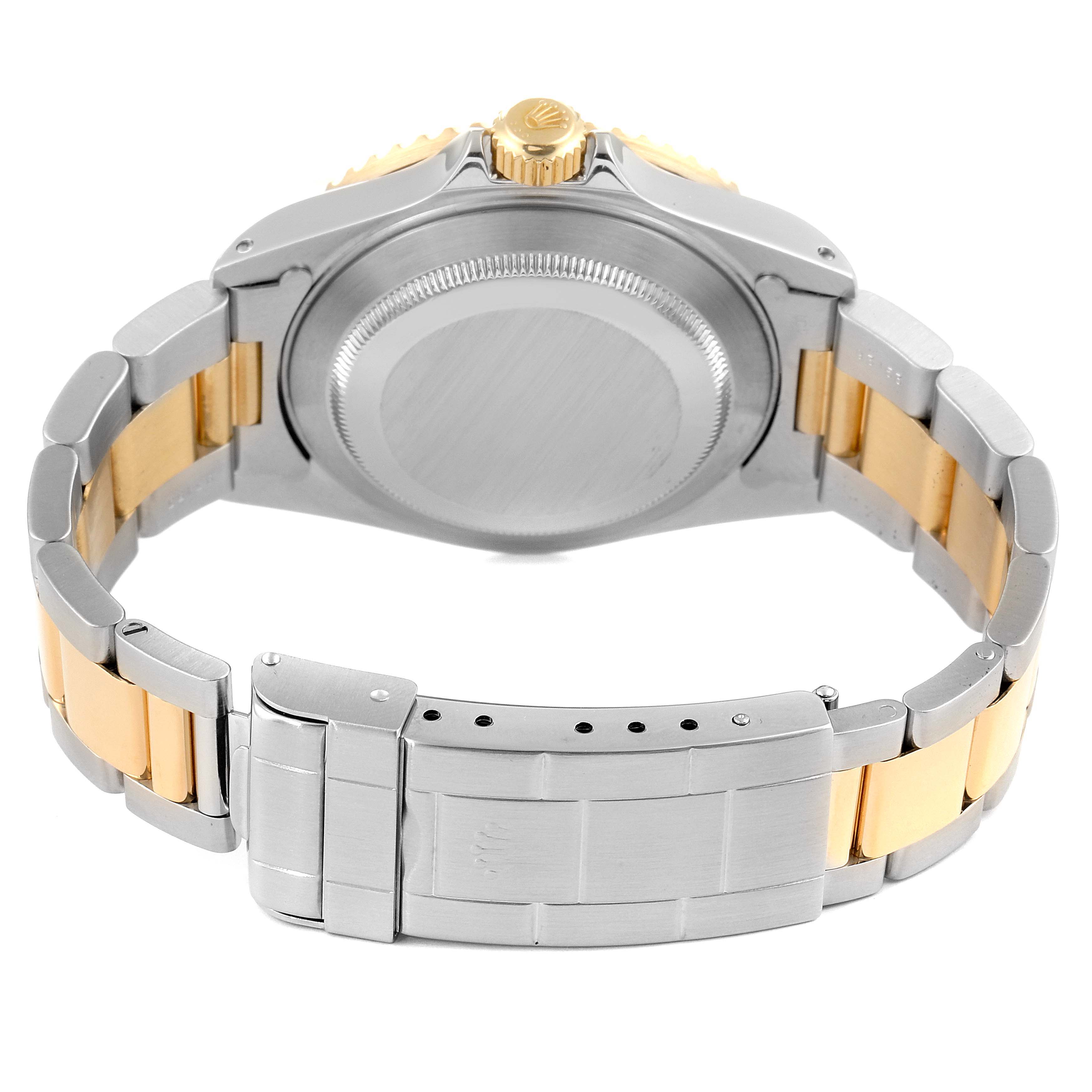 This image shows the rear angle of a Rolex Submariner 16613 Men's Steel and Gold (two tone) Grey Dial 16613 Men's Steel and Gold (two tone) Grey Dial, highlighting its case back, crown, and two-tone bracelet.